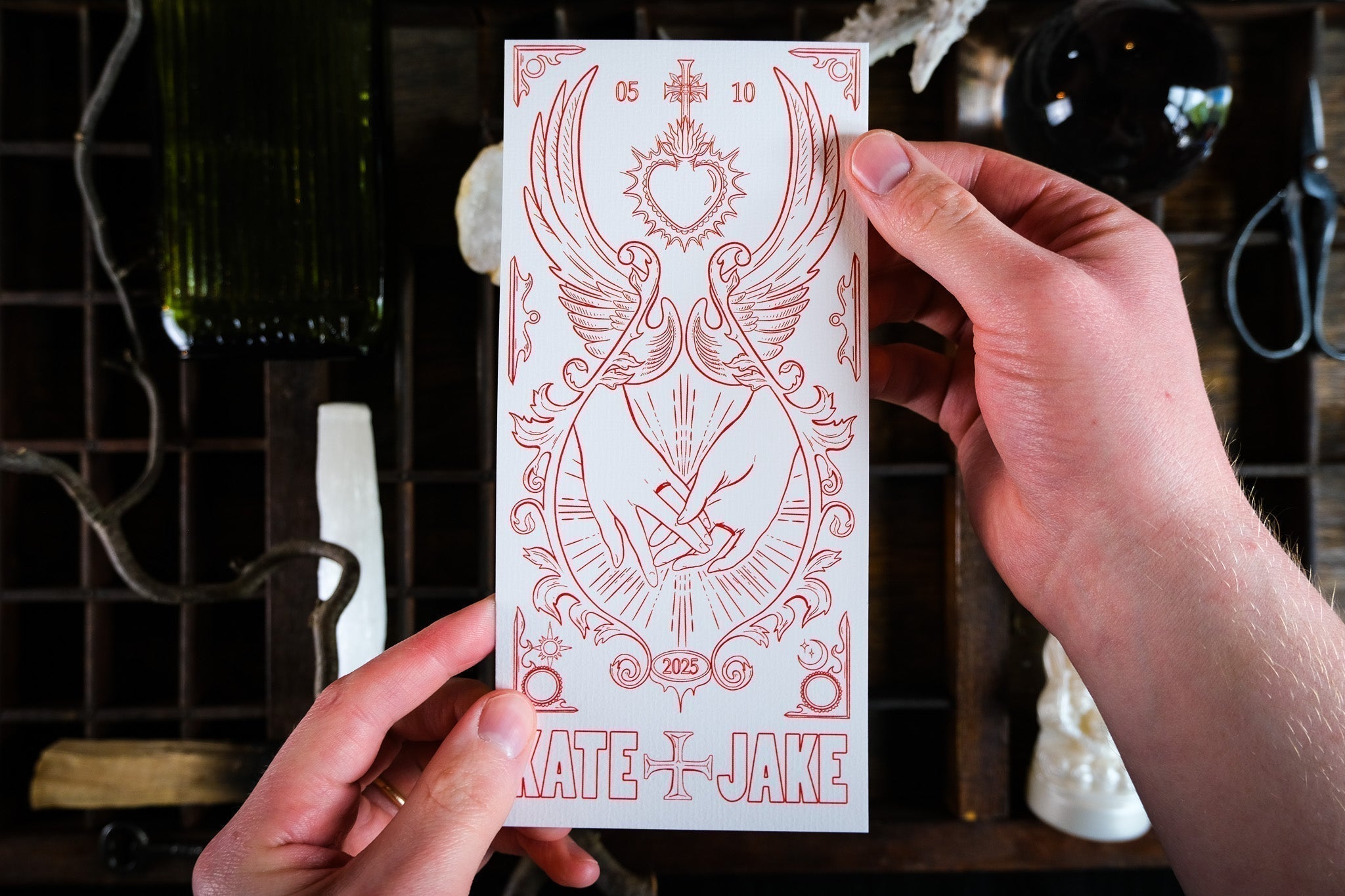 Gothic Star-Crossed Lovers save the date card with crossed swords and bleeding heart illustration for dark romance wedding stationery