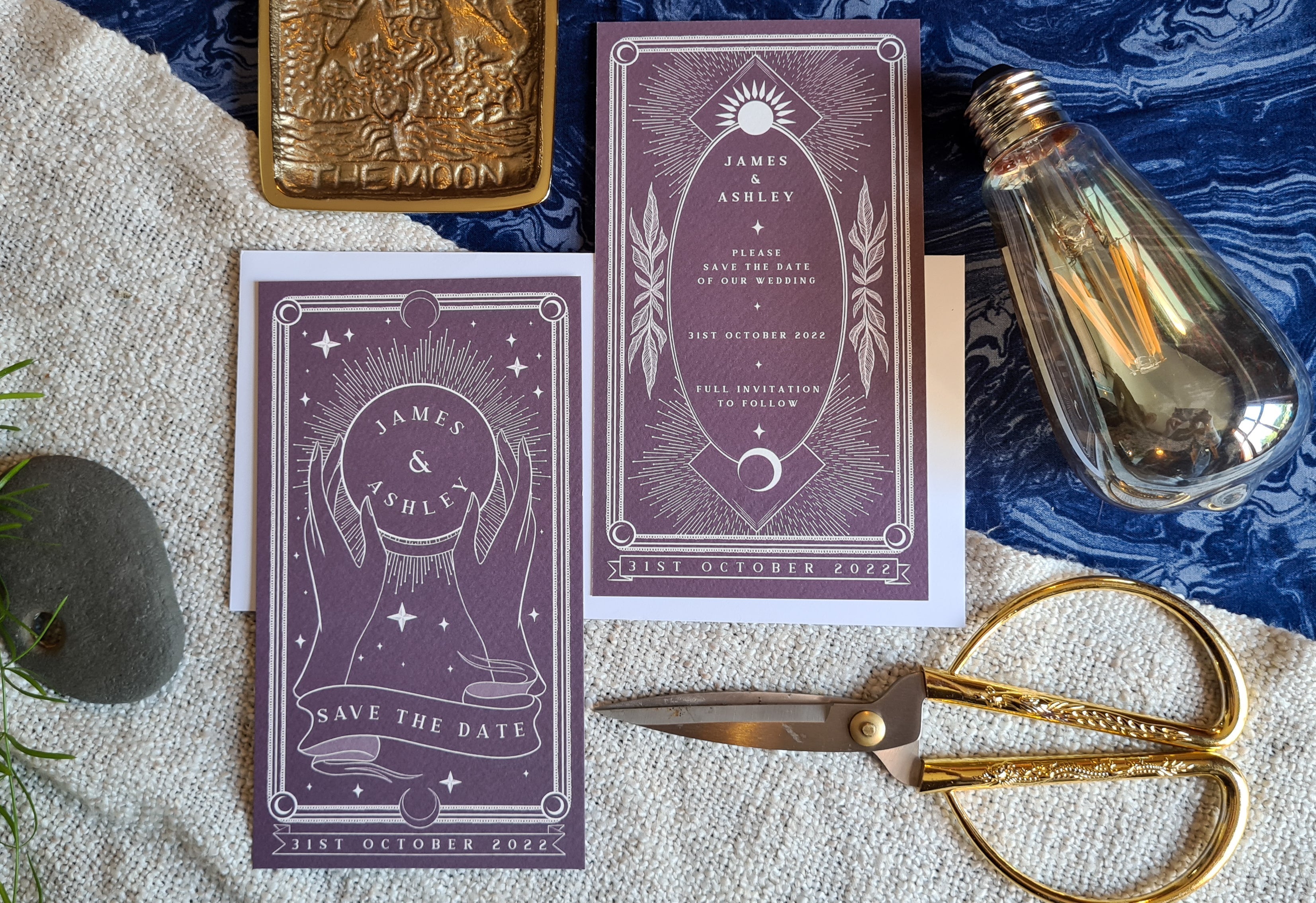 Bright Tarot Save The Date card with celestial design, customizable colors, including white envelopes, displayed with vintage decor.