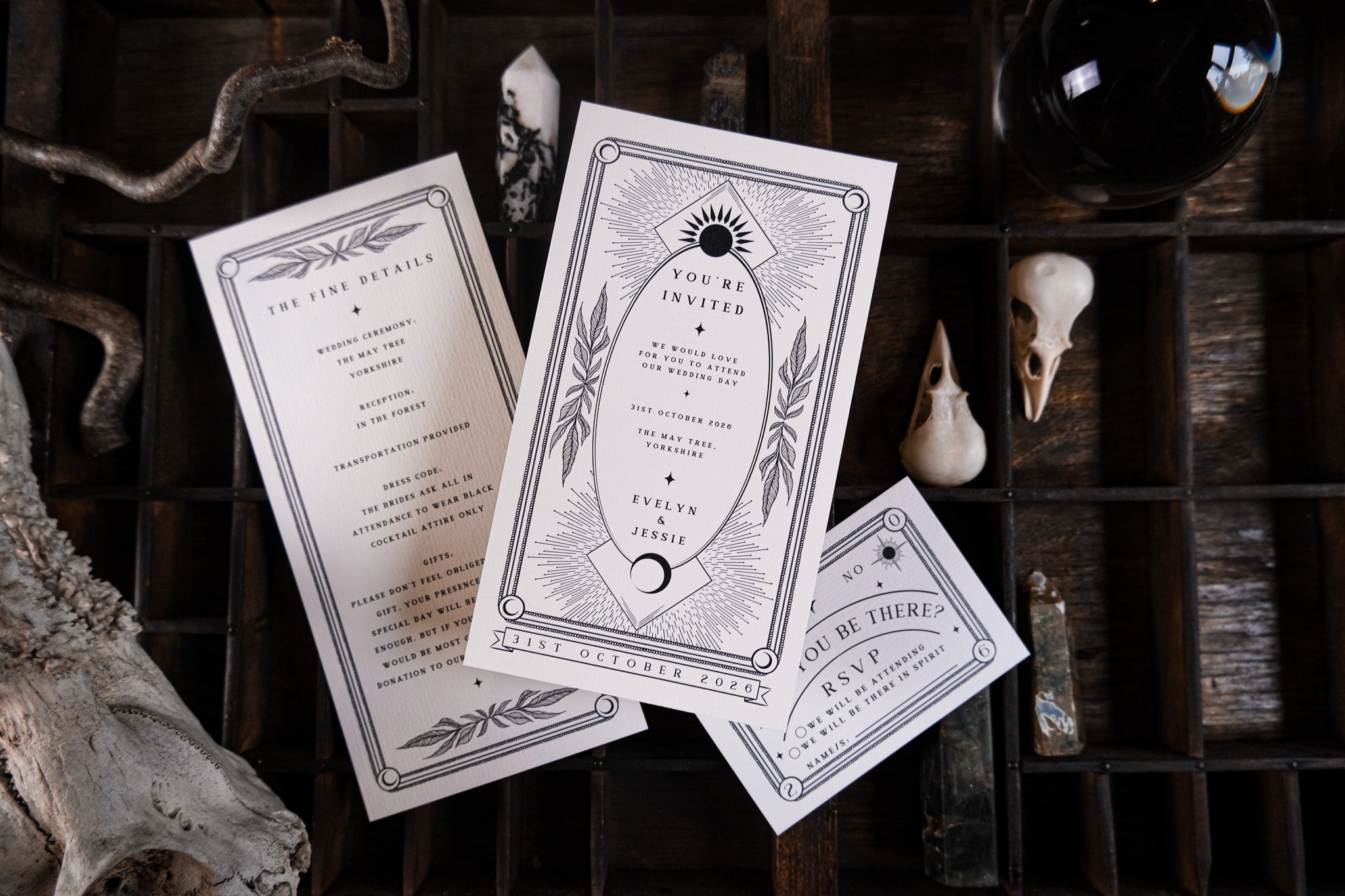 Luxury UK wedding stationery set with gothic, mystical black-and-white tarot-inspired invitations, RSVP, and details cards.