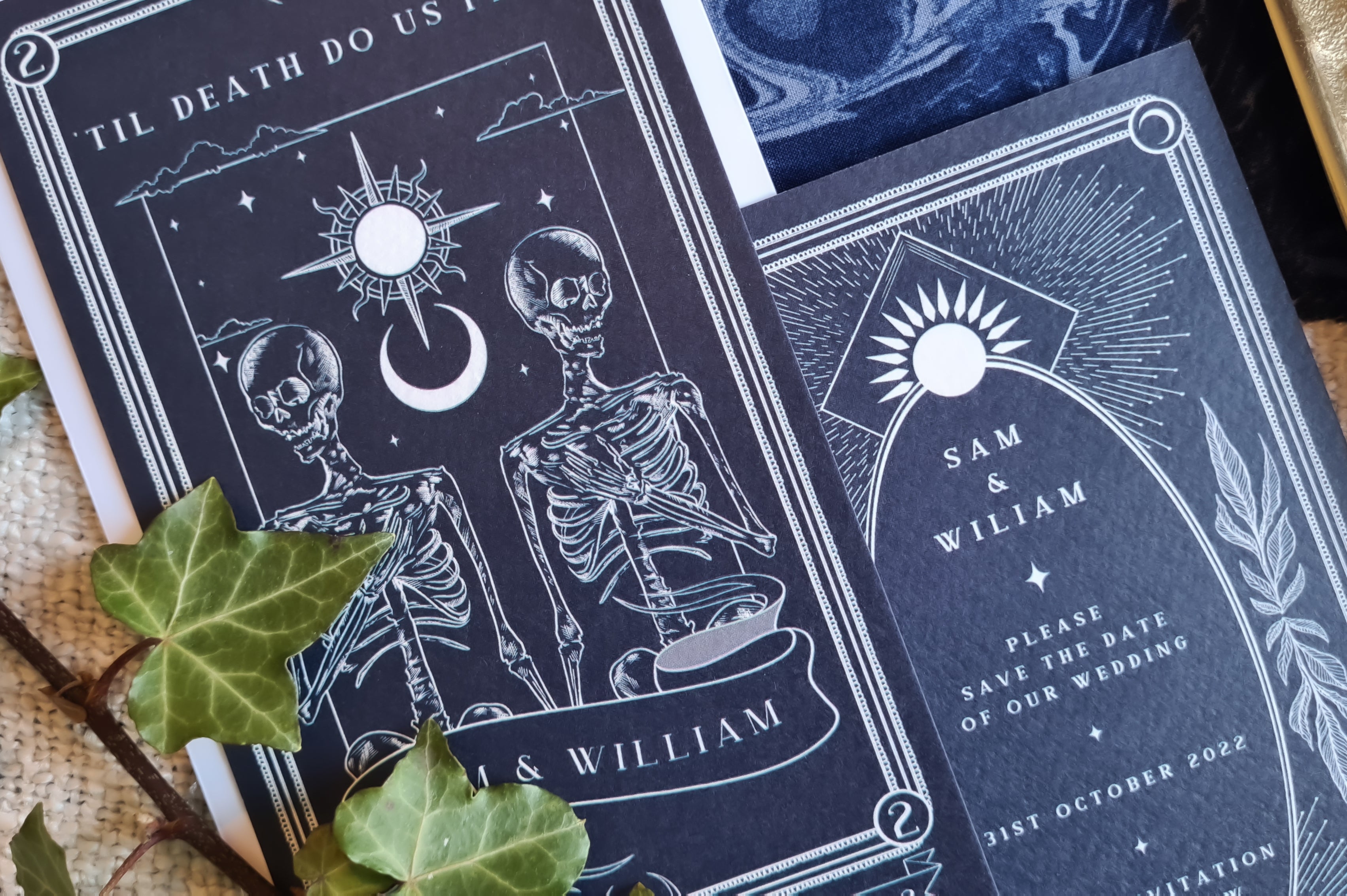 Gothic tarot style save the date card with two skeletons for alternative wedding details