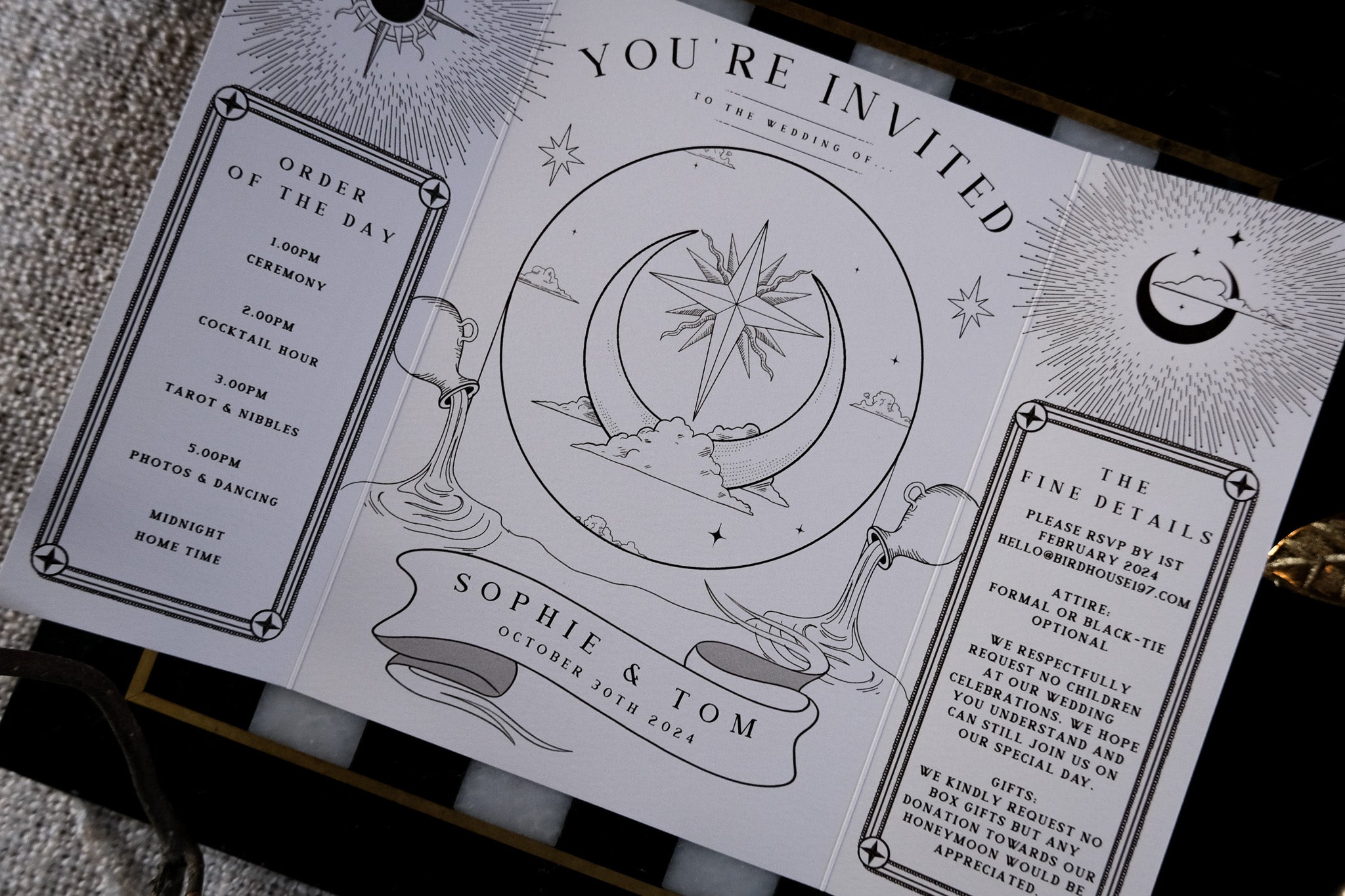 Luxury gatefold wedding invitation with celestial gothic tarot-inspired illustrations, premium textured card, and dramatic foil accents.