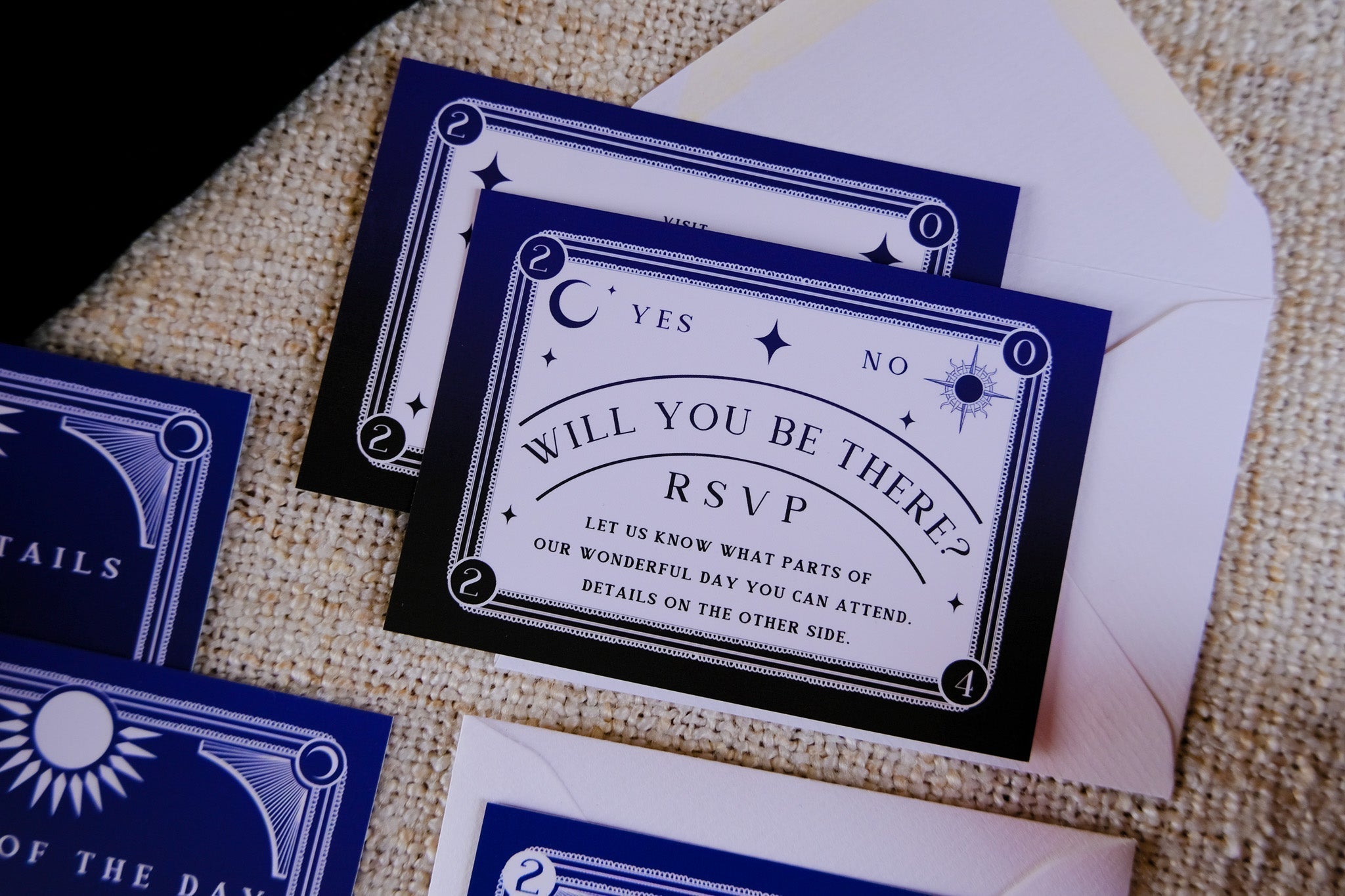 Dusk and Dawn foiled 3-piece wedding invitation suite with celestial sun and moon design on velvet soft-touch card