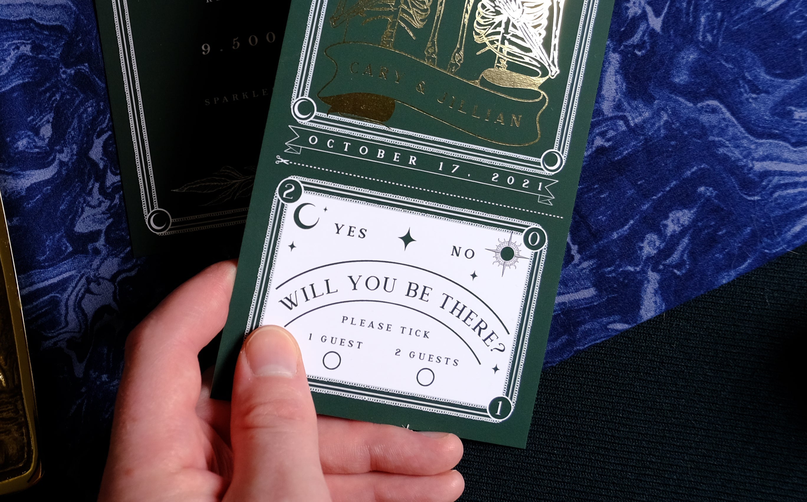 'Til Death Do Us Part' foiled tarot full invitation with RSVP, velvet paper, hand holding RSVP card.