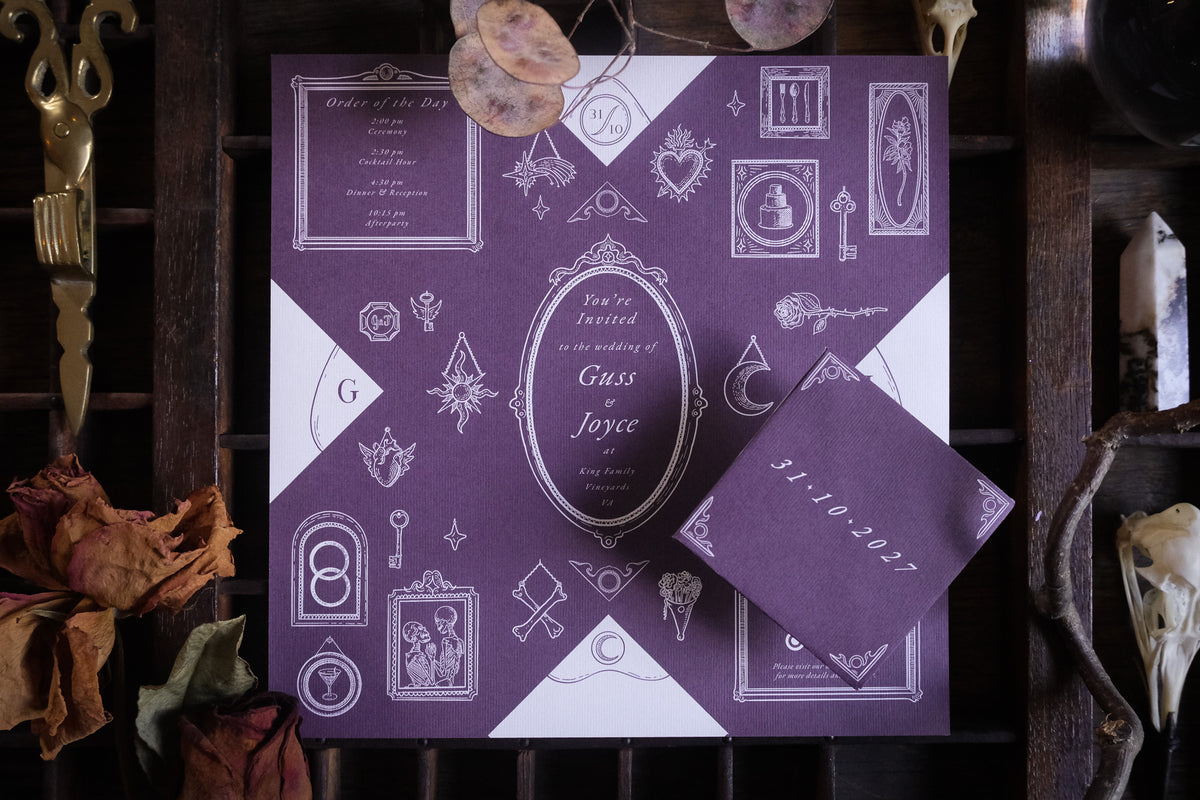Wedding invitation by Birdhouse197 with ornate white Victorian and gothic illustrations and dried flowers on a dark background.