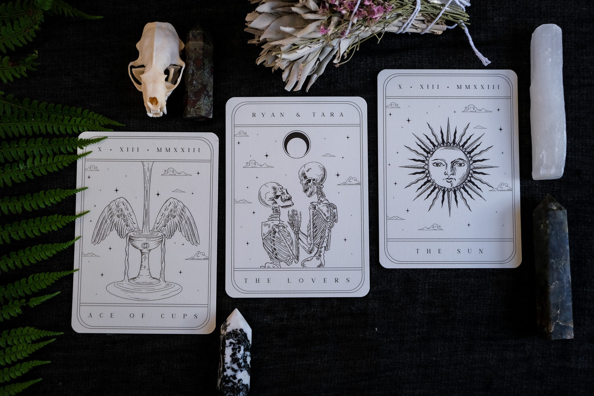 Tarot Card Spread 3-Piece Invitation Suite with 'The Lovers,' 'The Sun,' and 'Ace of Cups' cards on display, featuring personalized details and quality velvet paper.