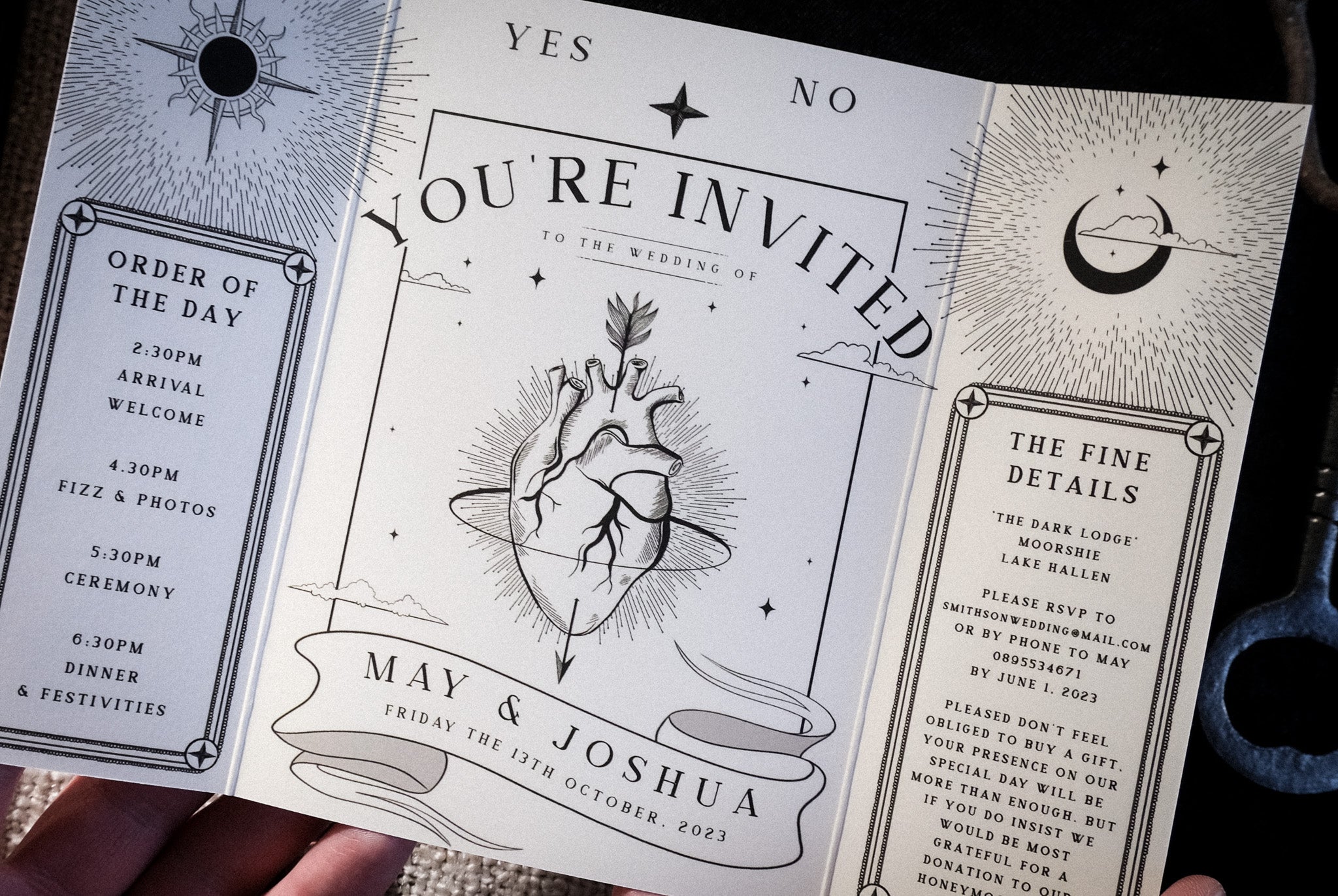 'The Bleeding Heart' foiled gatefold wedding invitation with celestial design, featuring order of the day and fine details.