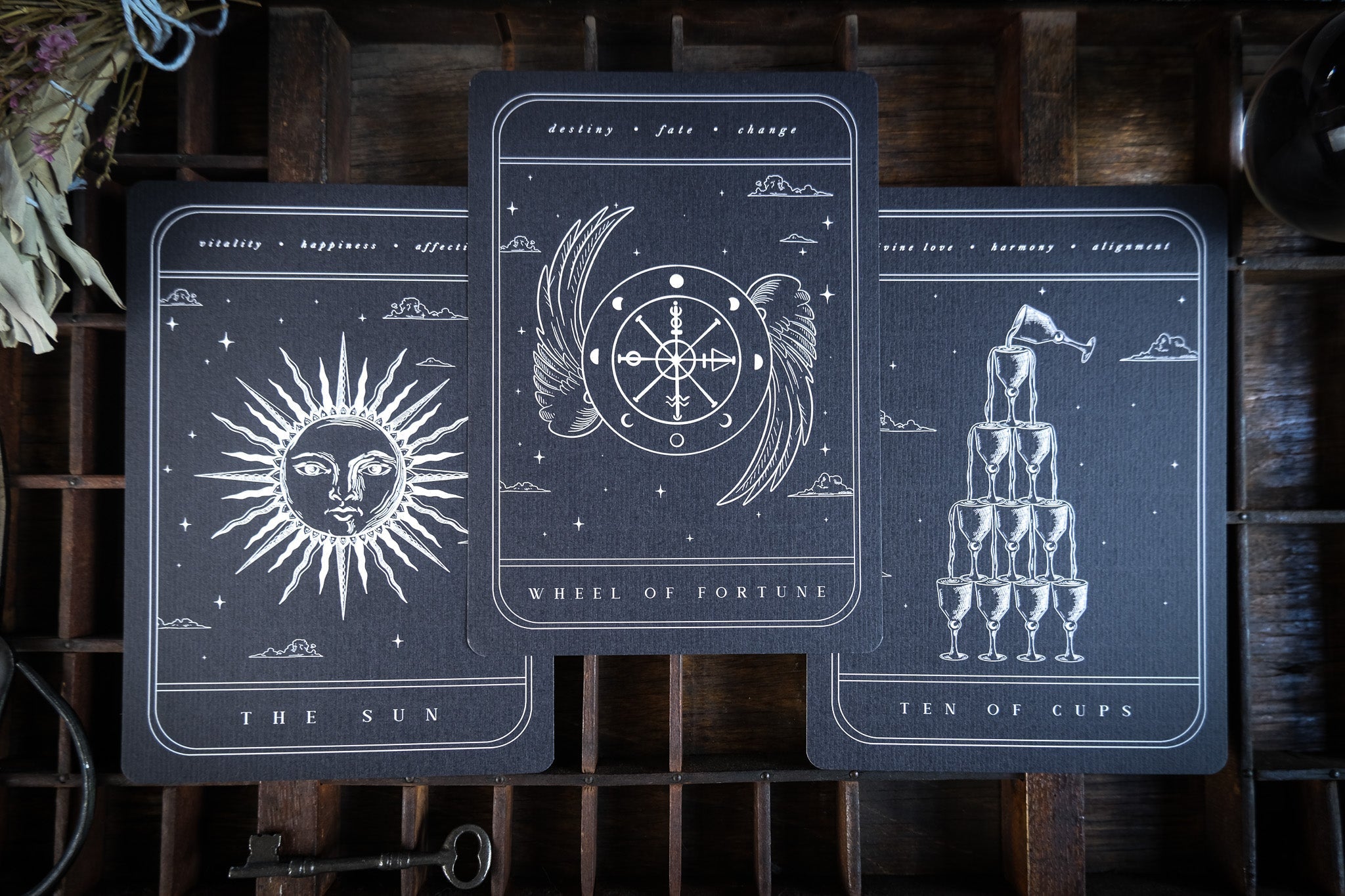 Tarot Card Art Print featuring The Sun, Wheel of Fortune, and Ten of Cups on black cardstock with white gothic designs