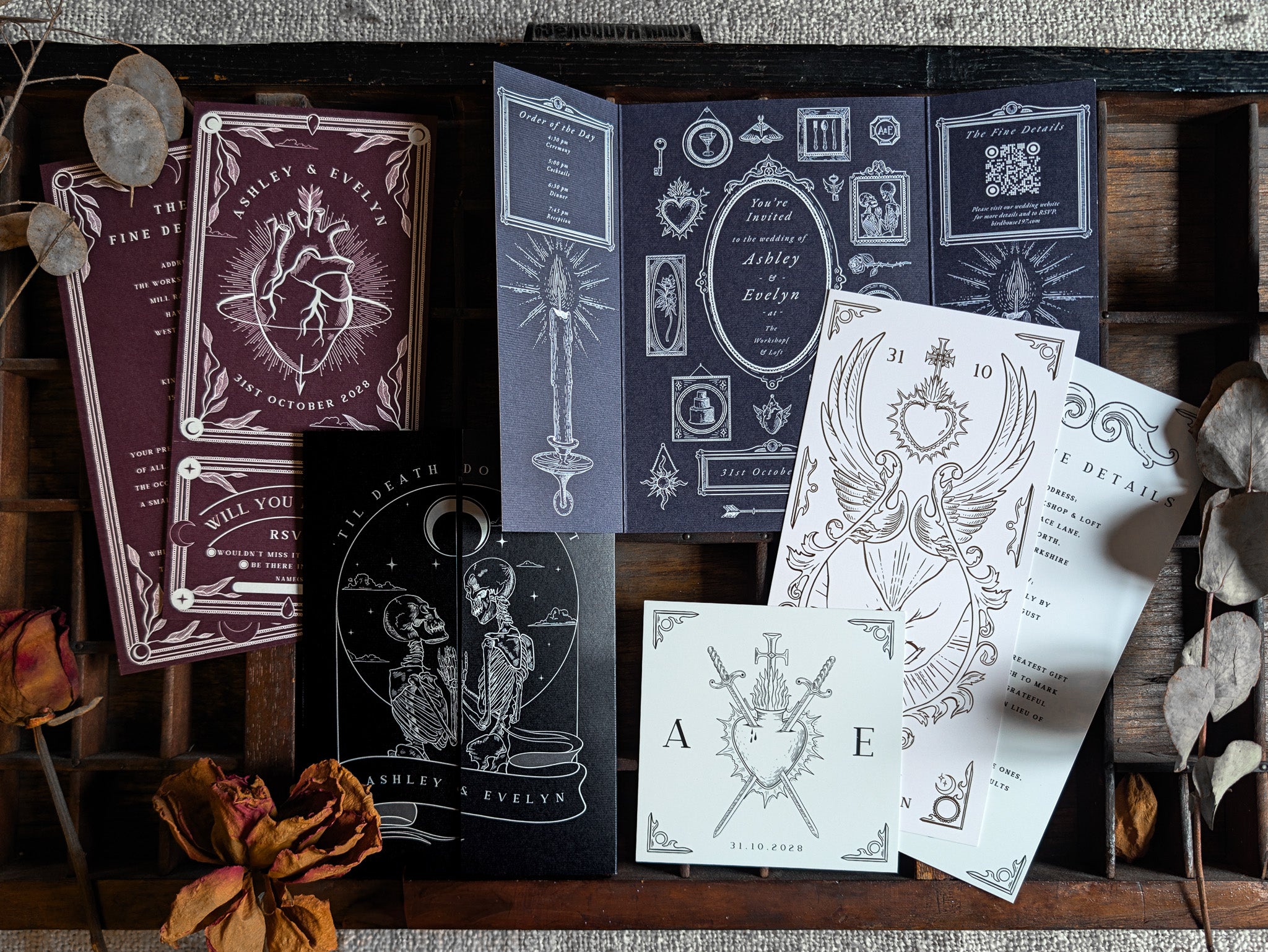 Invitation suite sample pack from Birdhouse197, showing gatefold and multi-piece designs on a wooden tray.