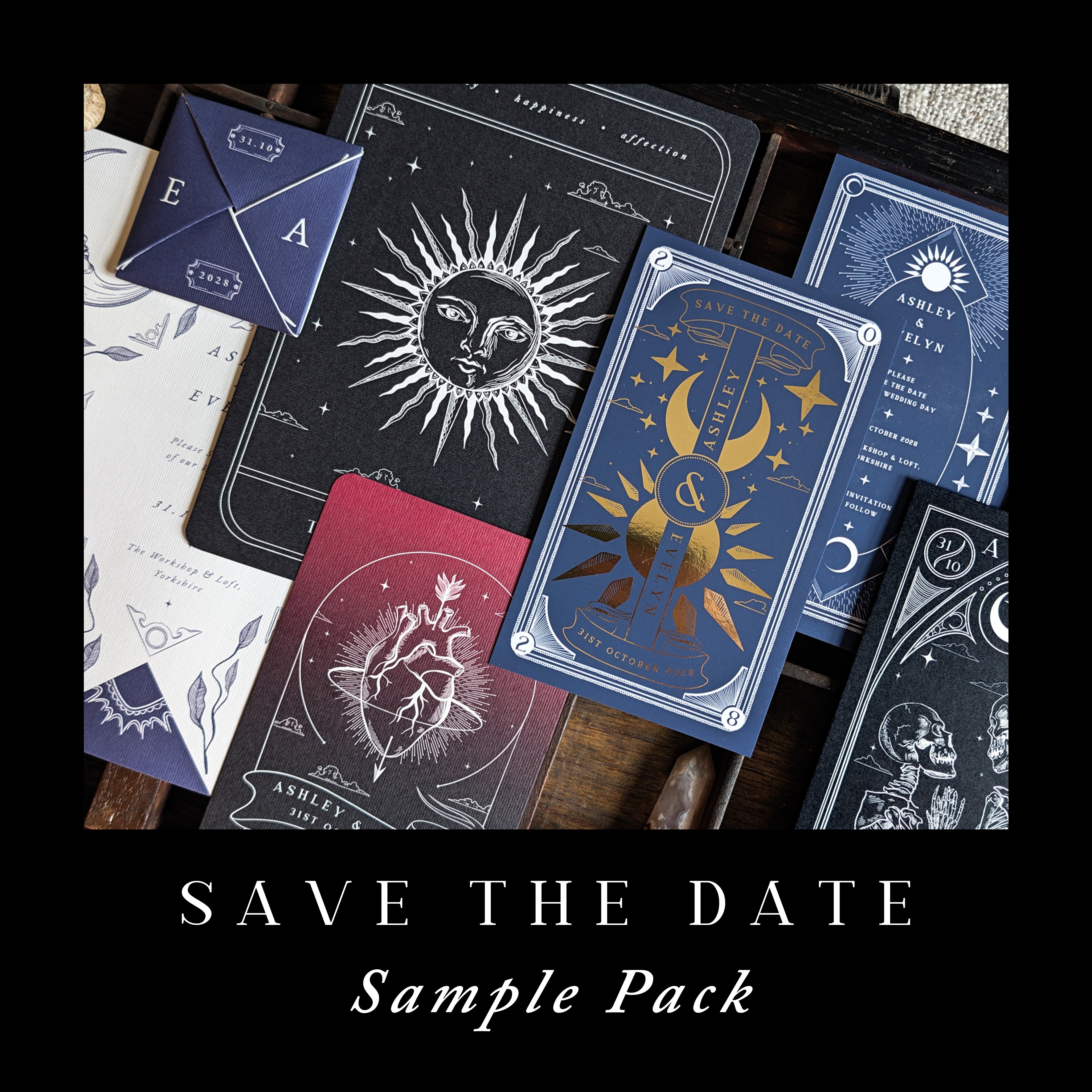A luxurious selection of UK wedding stationery, including personalised save the date cards and envelopes, arranged on a dramatic dark background. The designs feature celestial sun, moon, and star motifs with mystical styling; some elements are enhanced by elegant gold foil accents for a premium finish.