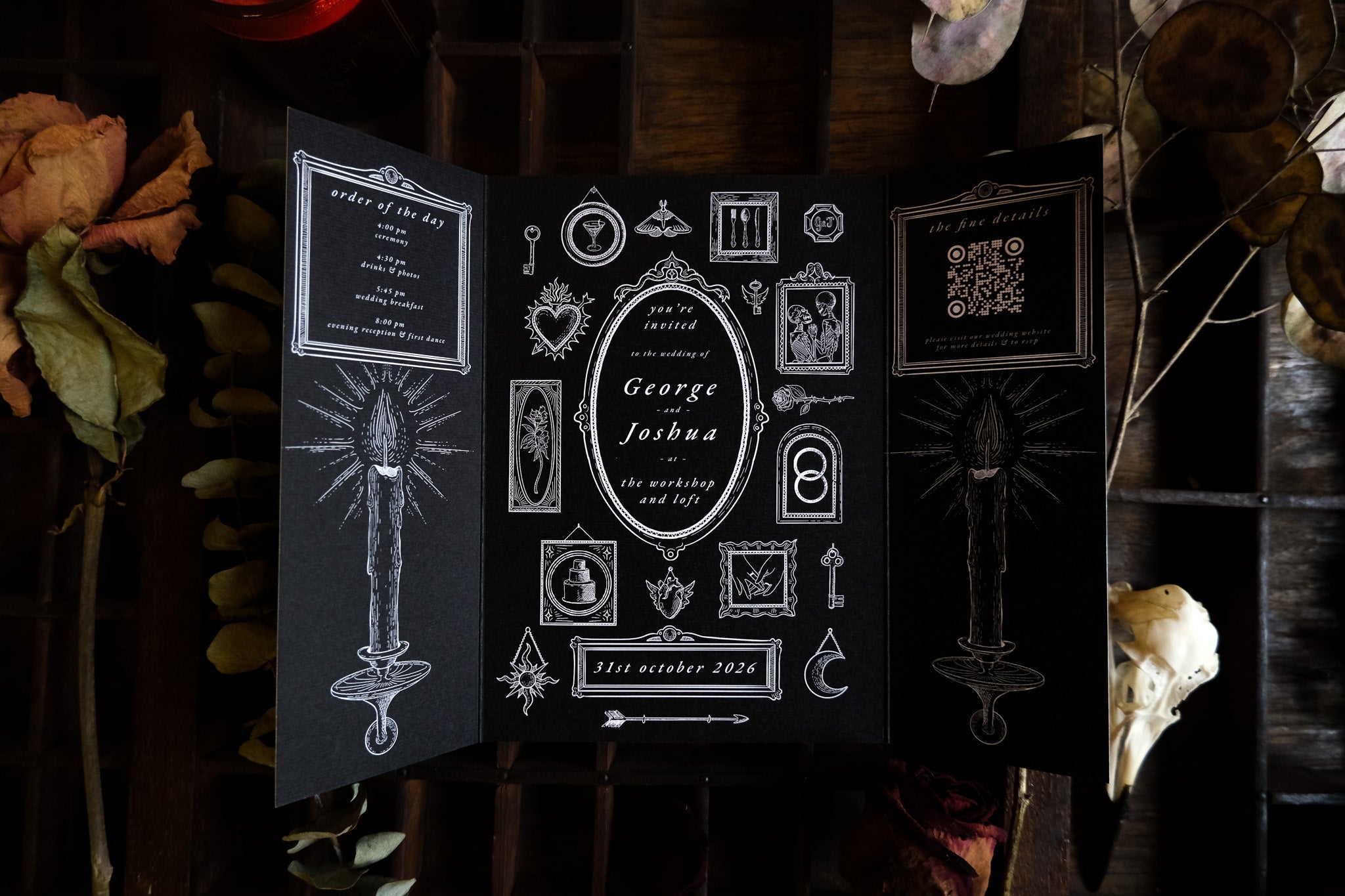 Luxury black gatefold wedding invitation with gothic and mystical white illustrations; alternative UK wedding stationery.