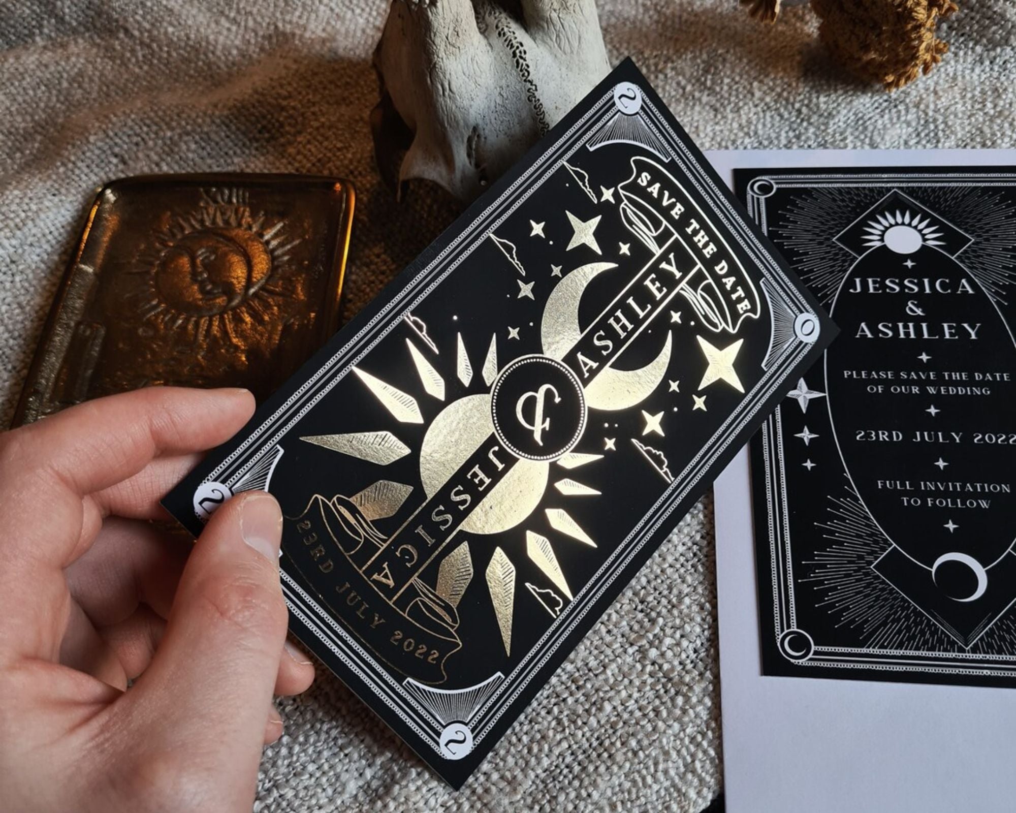 Dusk and Dawn foiled celestial save the date card with sun and moon design on velvet soft-touch card