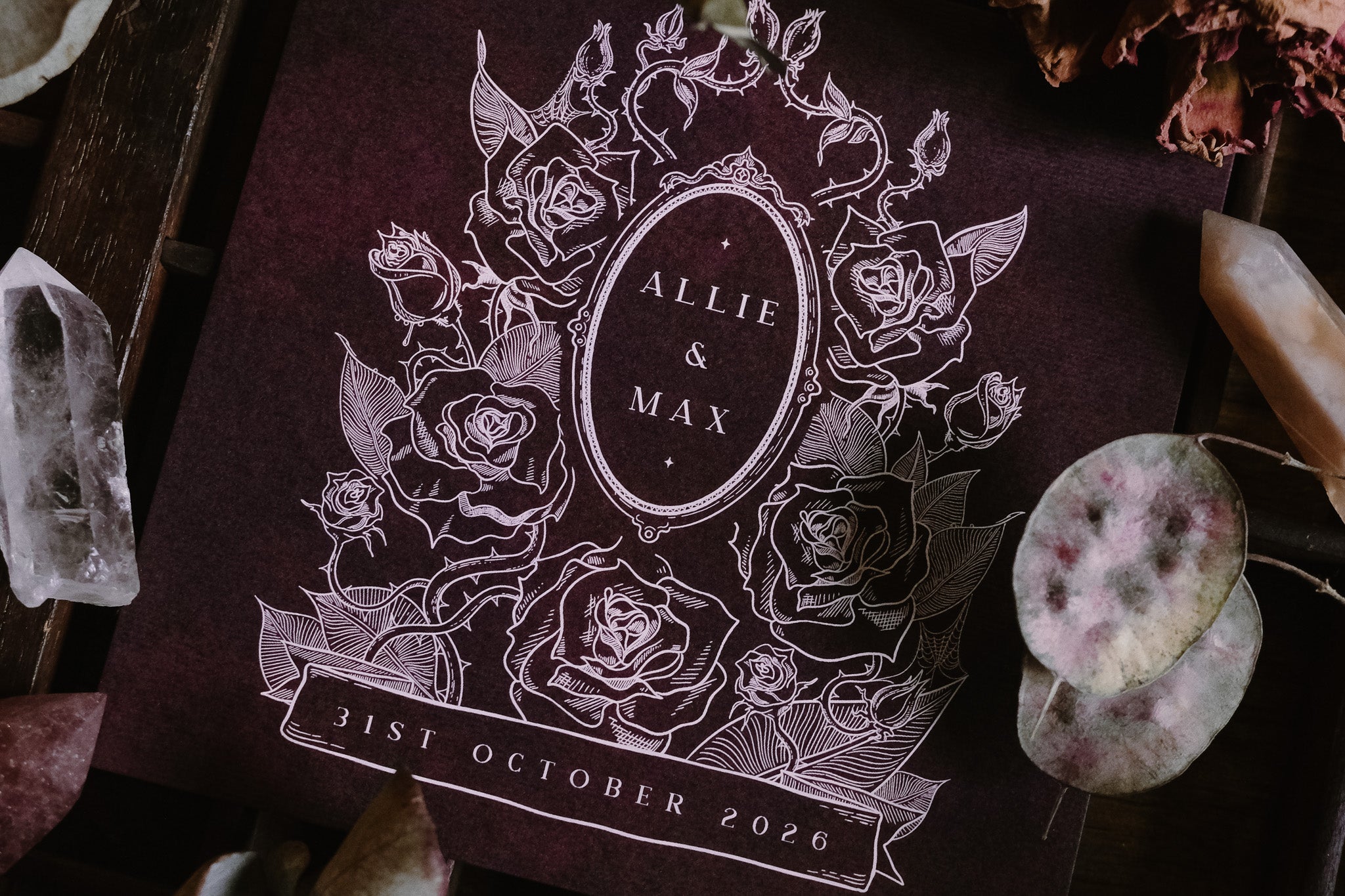 Luxury UK wedding stationery featuring a gothic, dark floral Victorian design with white rose art, crystals, and botanical accents.