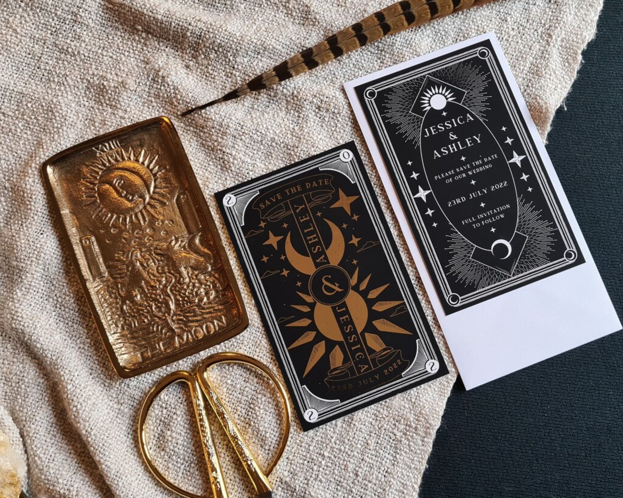 Dusk and Dawn foiled save the date card with celestial sun and moon design on velvet soft-touch card