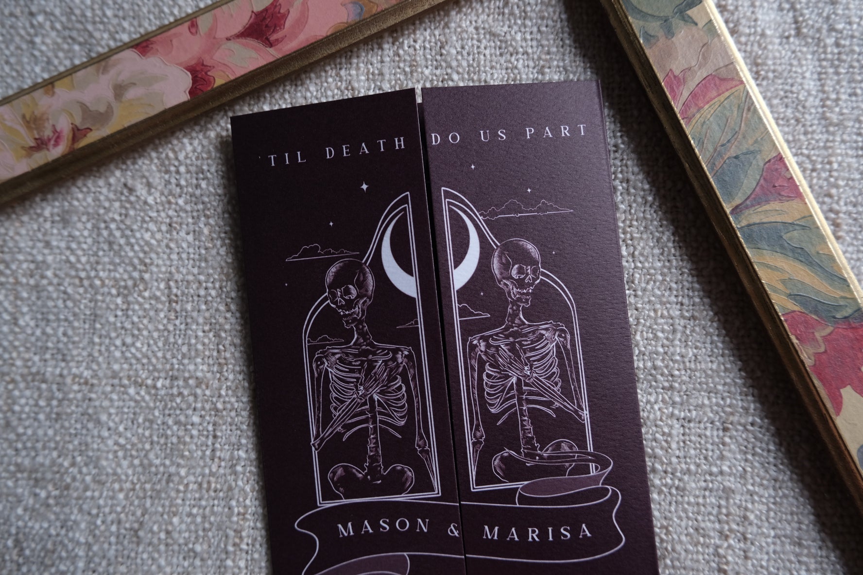 Gothic skeleton couple gatefold wedding invitation opening to full wedding details on matte textured card