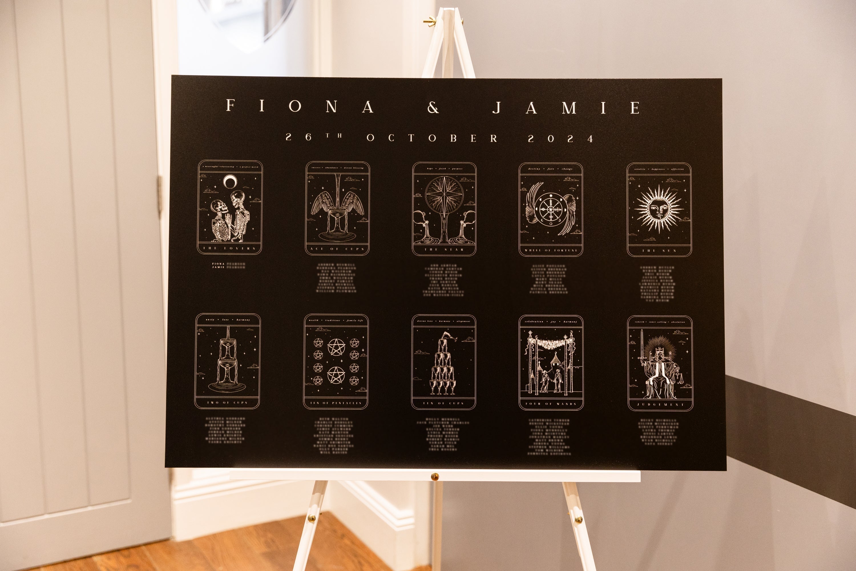 Luxury wedding seating plan with personalised tarot-inspired cards, vintage motifs, and mystical details for a dramatic UK reception.