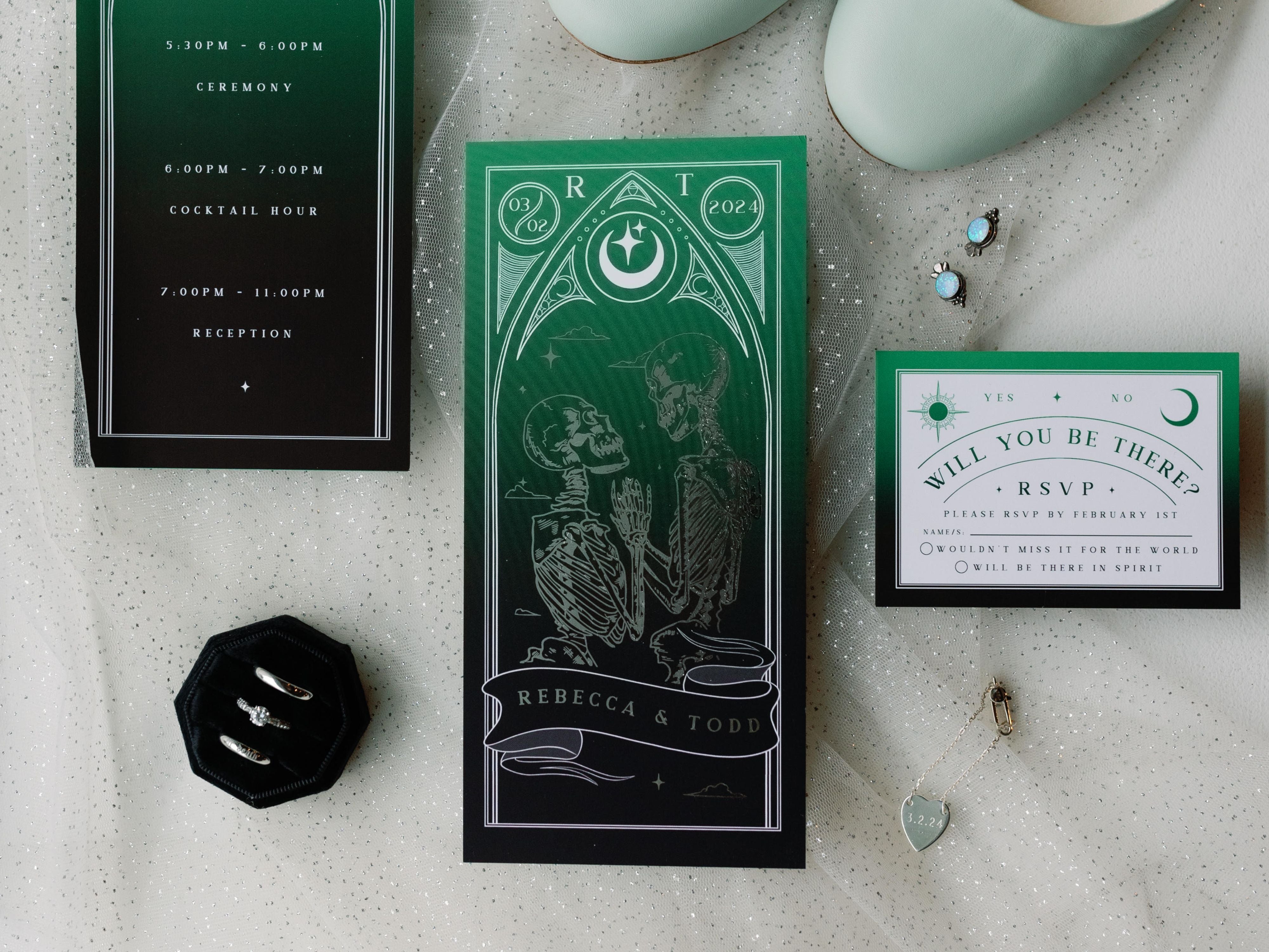 'Til Death Do Us Part' Lovers Foiled Tarot Card 3 Piece Invitation Suite on display with rings and decor.