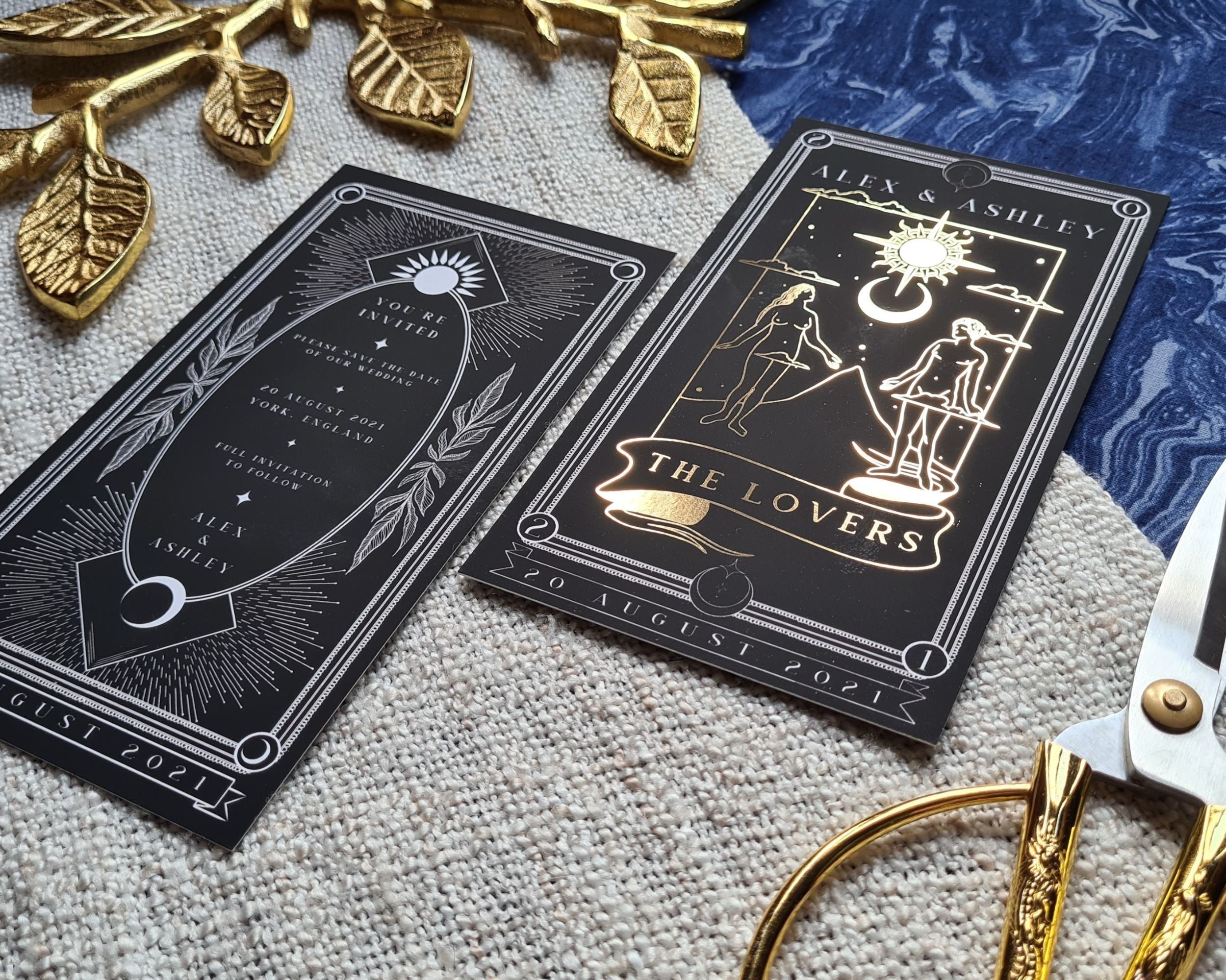 Foiled Save The Date cards inspired by 'The Lovers' tarot card, featuring luxurious foil detailing and customizable options.