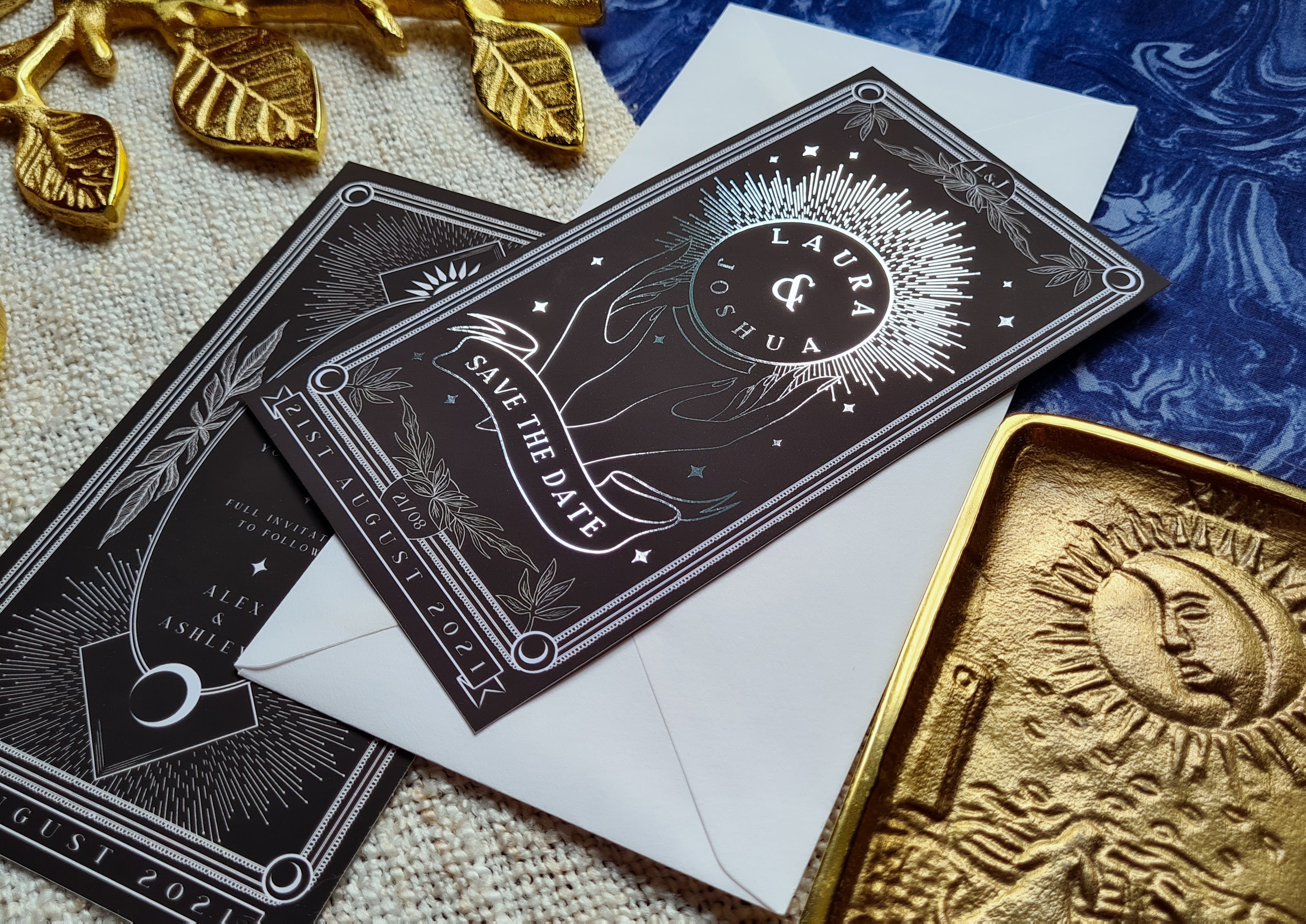 'Crystal Ball' foiled tarot card save the date with white envelope and mystical design on blue background.