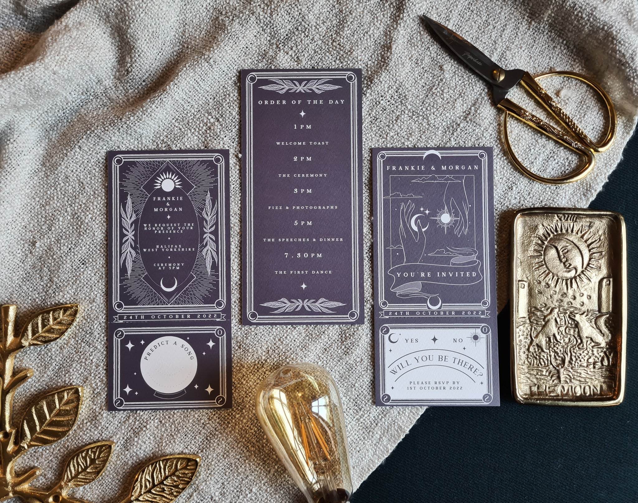 'Sun & Moon' Tarot Full Invitation set with RSVP card and decorative elements on a cloth background.