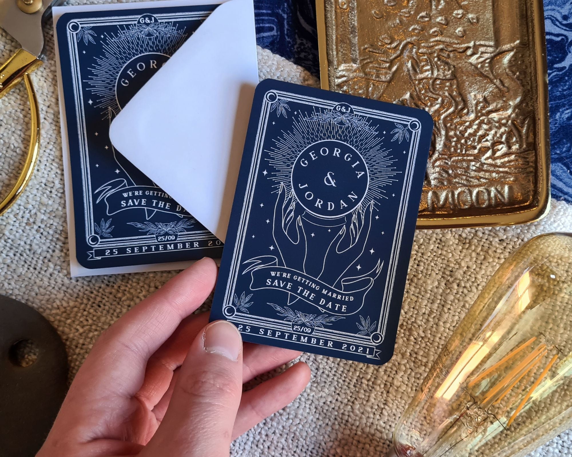 Crystal Ball Tarot Save The Date mini magnet with white envelopes and intricate design.