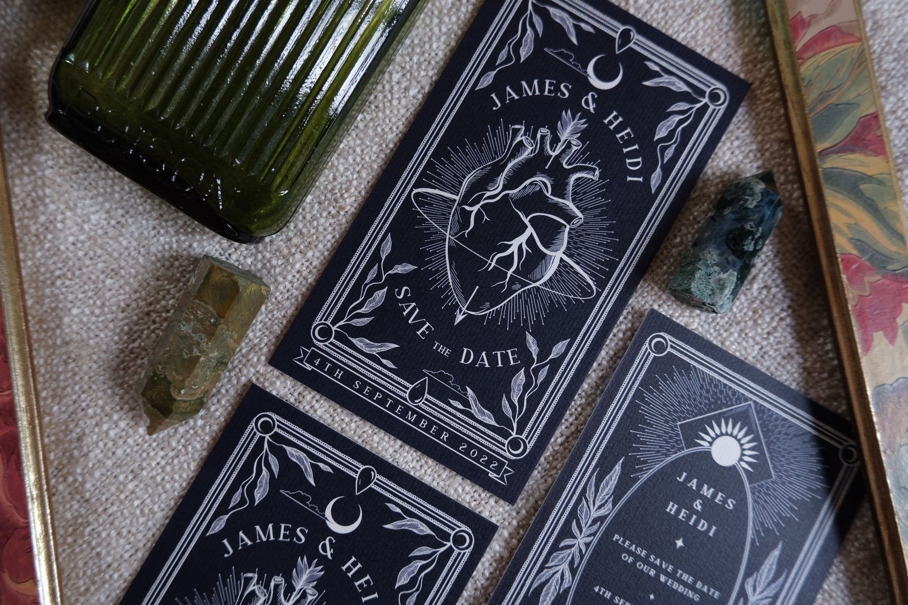 'The Bleeding Heart' Tarot Save The Date Card with illustrated heart design, black and white motif, and customizable colors.