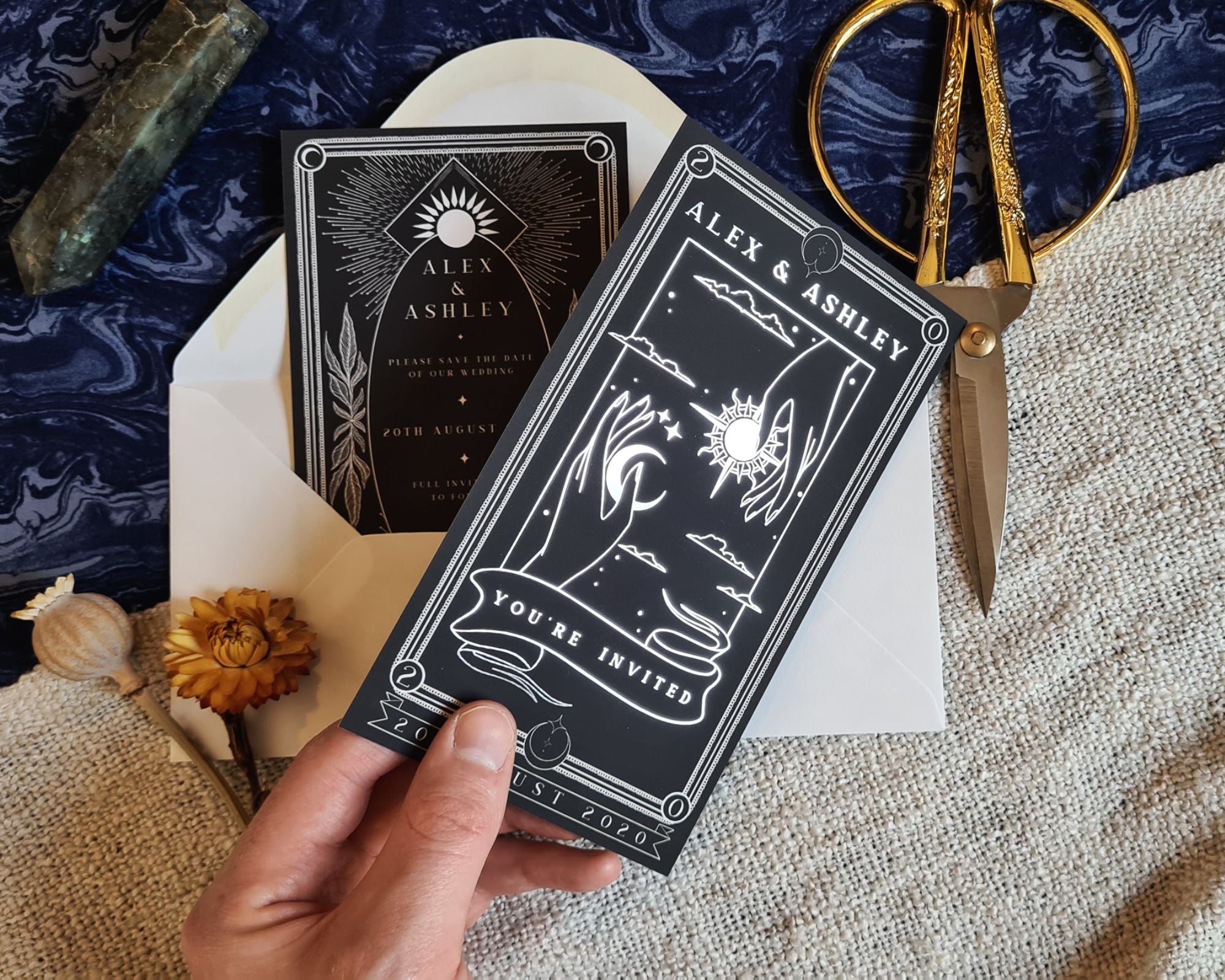 'Sun & Moon' foiled tarot card save the date with white envelopes and elegant design.