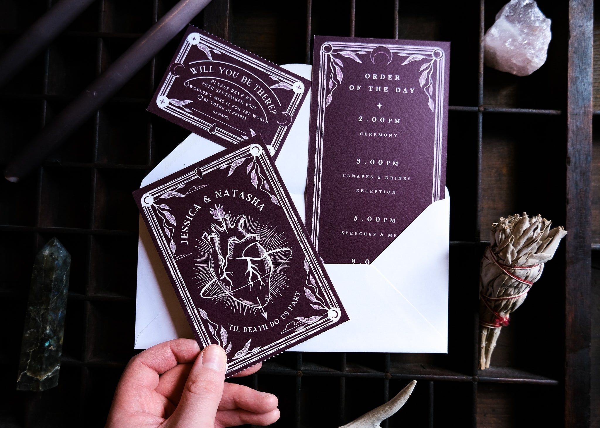 'Bleeding Heart' Tarot Full Invitation with RSVP Options featuring dark-themed design, cards, and white envelope.