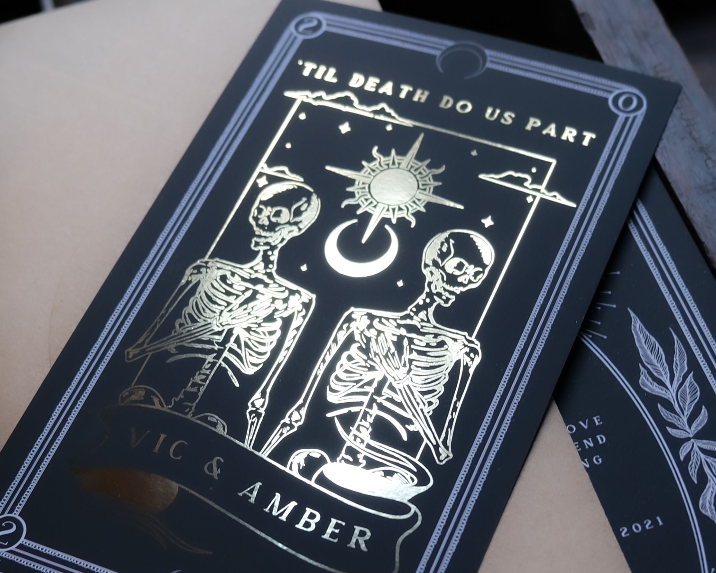 'Til Death Do Us Part' foiled save the date card with gold detailing and tarot theme.