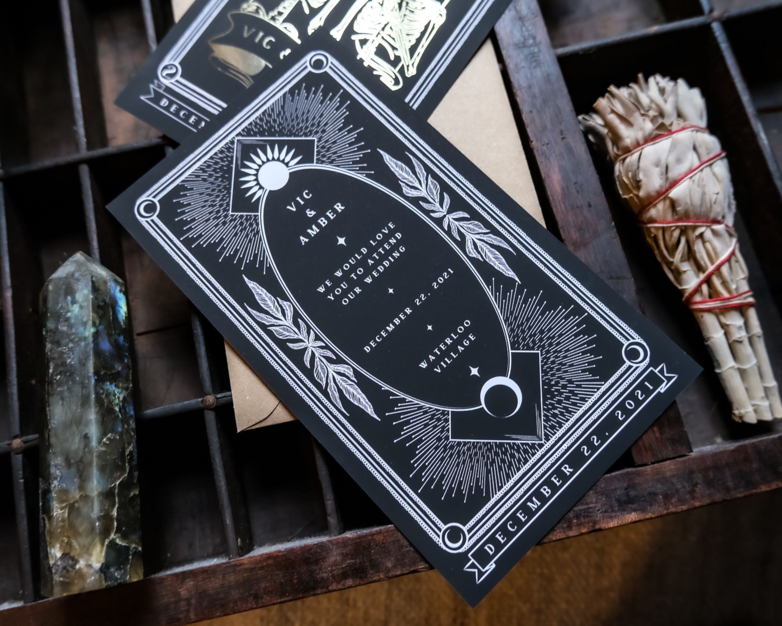Foiled save the date card with gothic tarot design and intricate details.