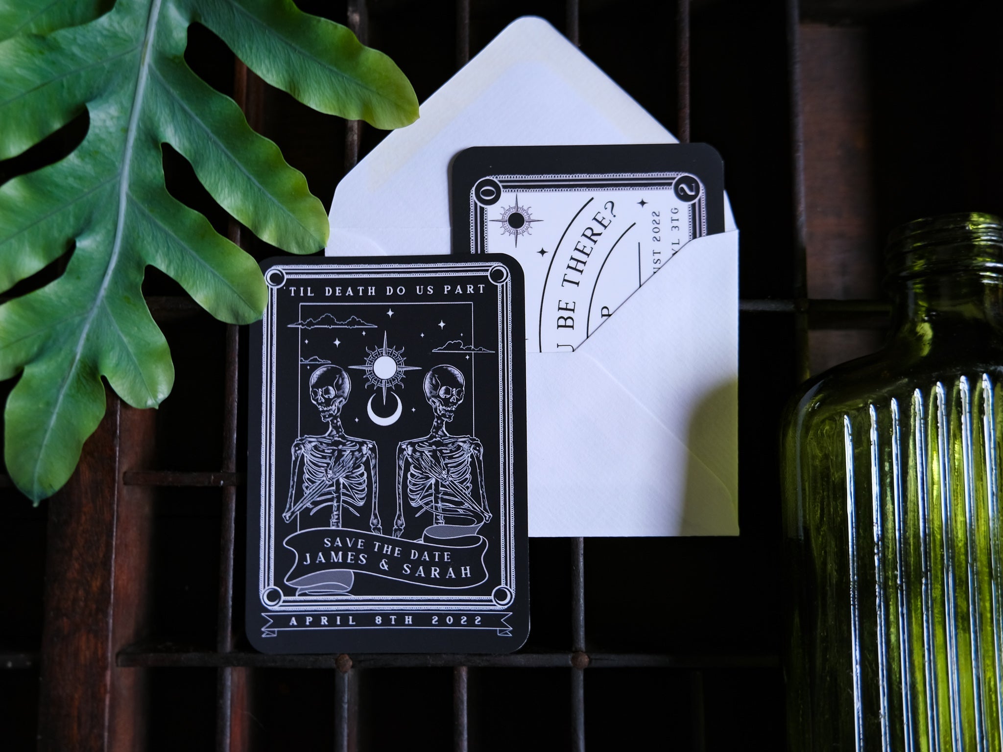 Tarot-themed save the date magnet and RSVP card set with white envelope.