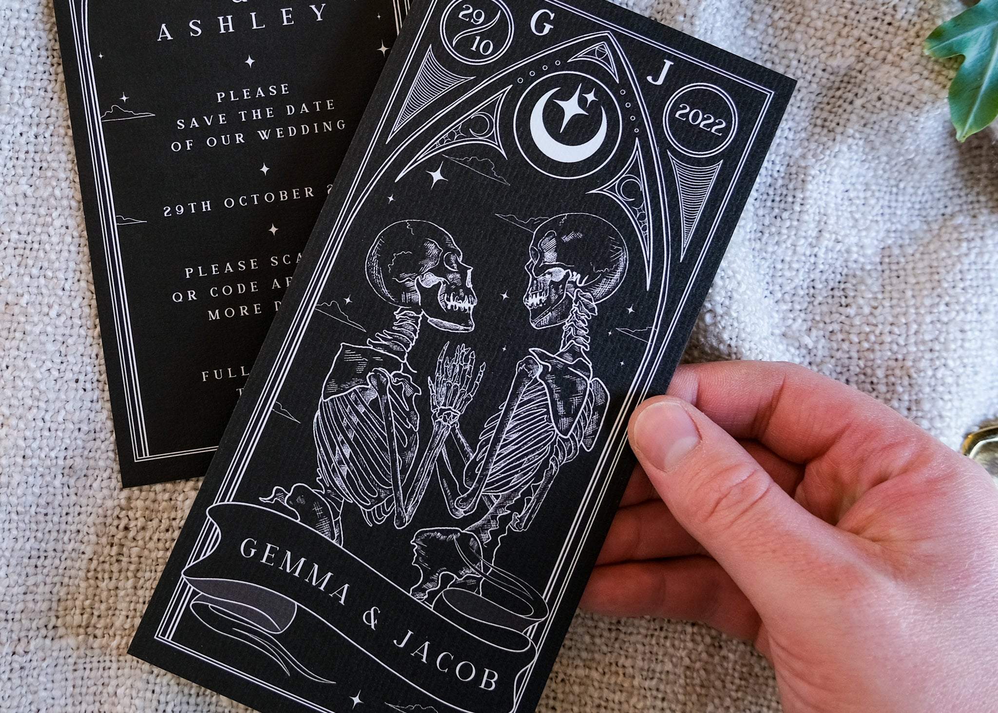 Lovers Tarot Save The Date card featuring skeletons in an embrace, gothic wedding theme.