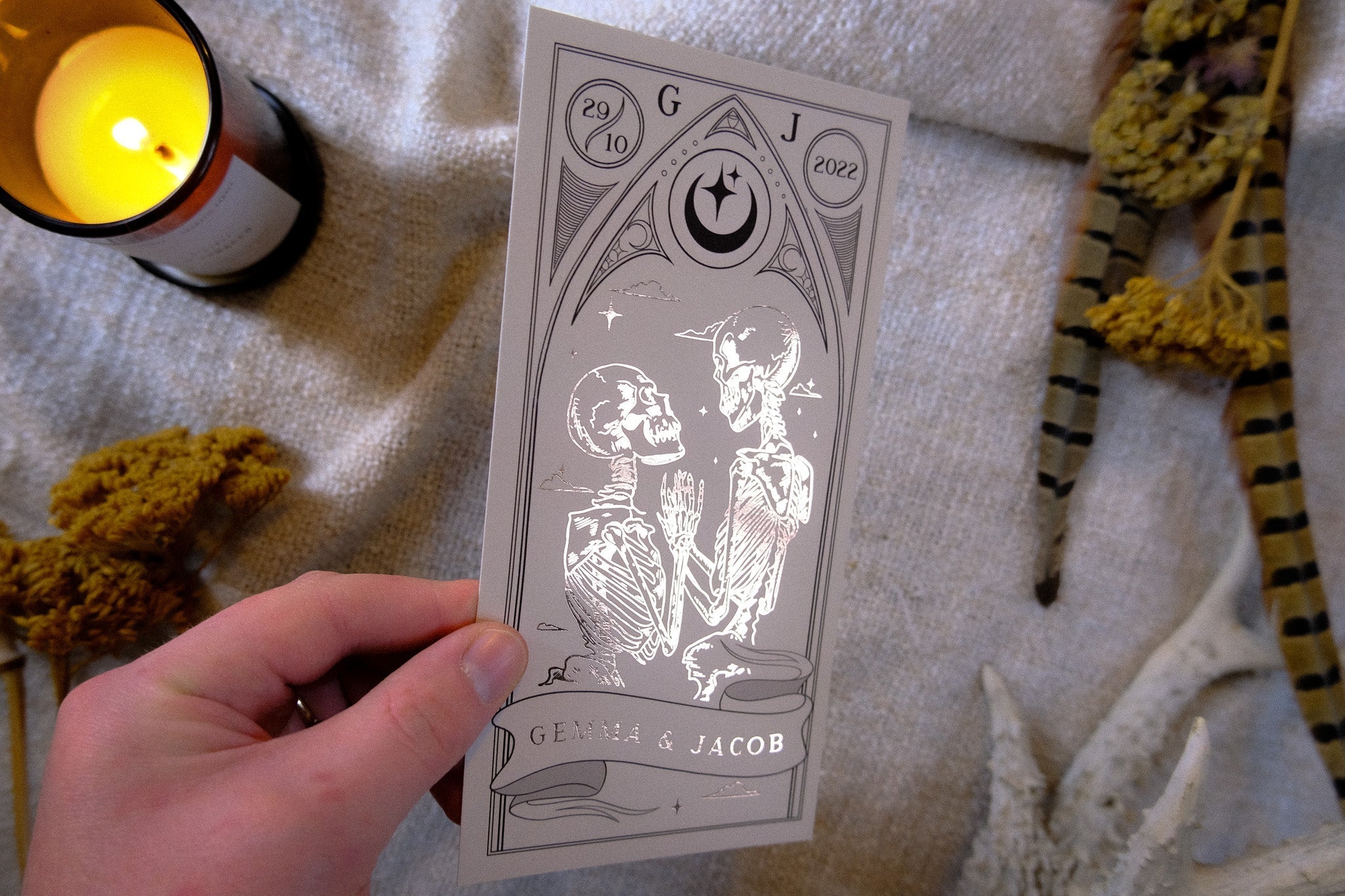 Luxurious 'Til Death Do Us Part' foiled tarot save the date card with skeleton design.
