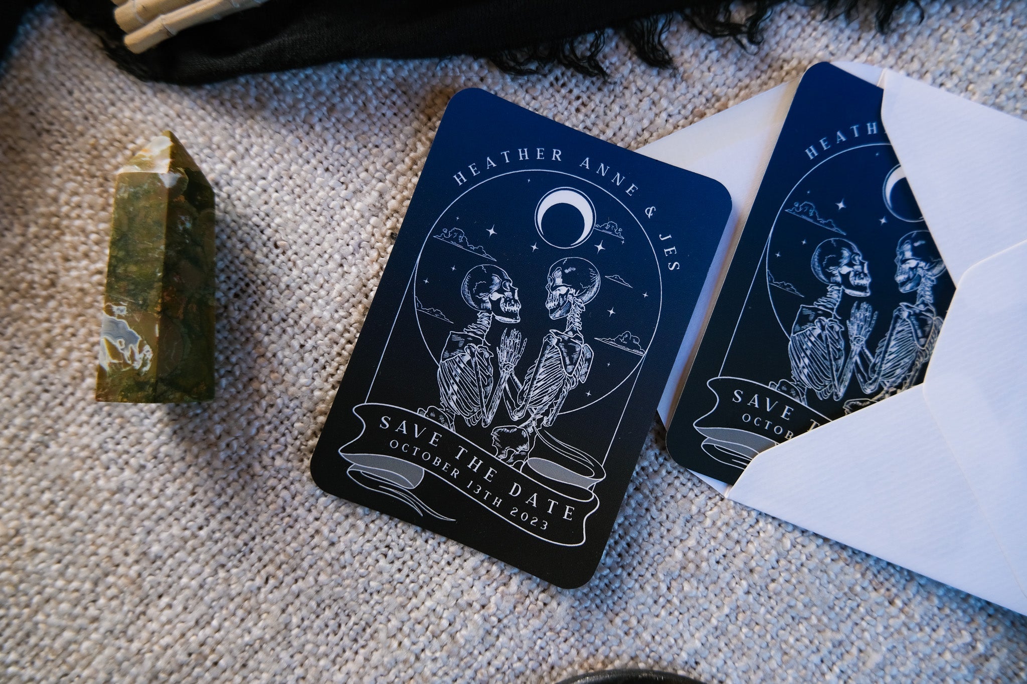 Skeleton Lovers 'Til Death Do Us Part' Tarot Save The Date Mini Magnet with white envelopes.