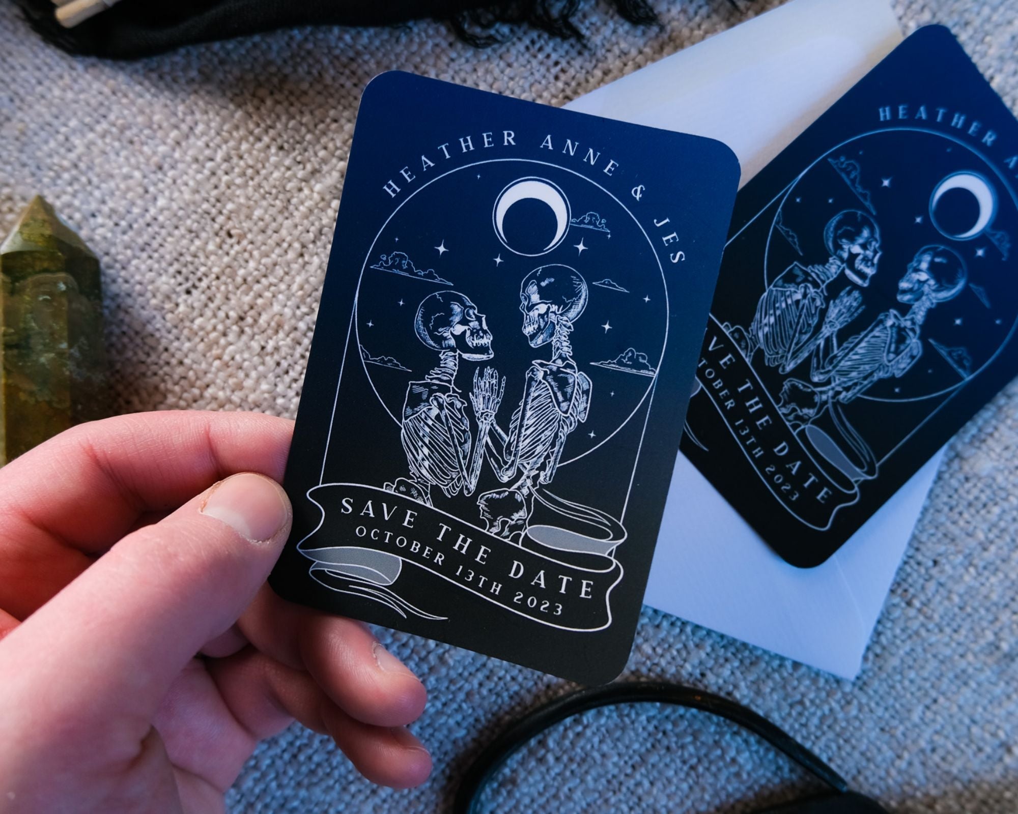 Skeleton Lovers 'Til Death Do Us Part' tarot-themed save the date magnet with white envelope.
