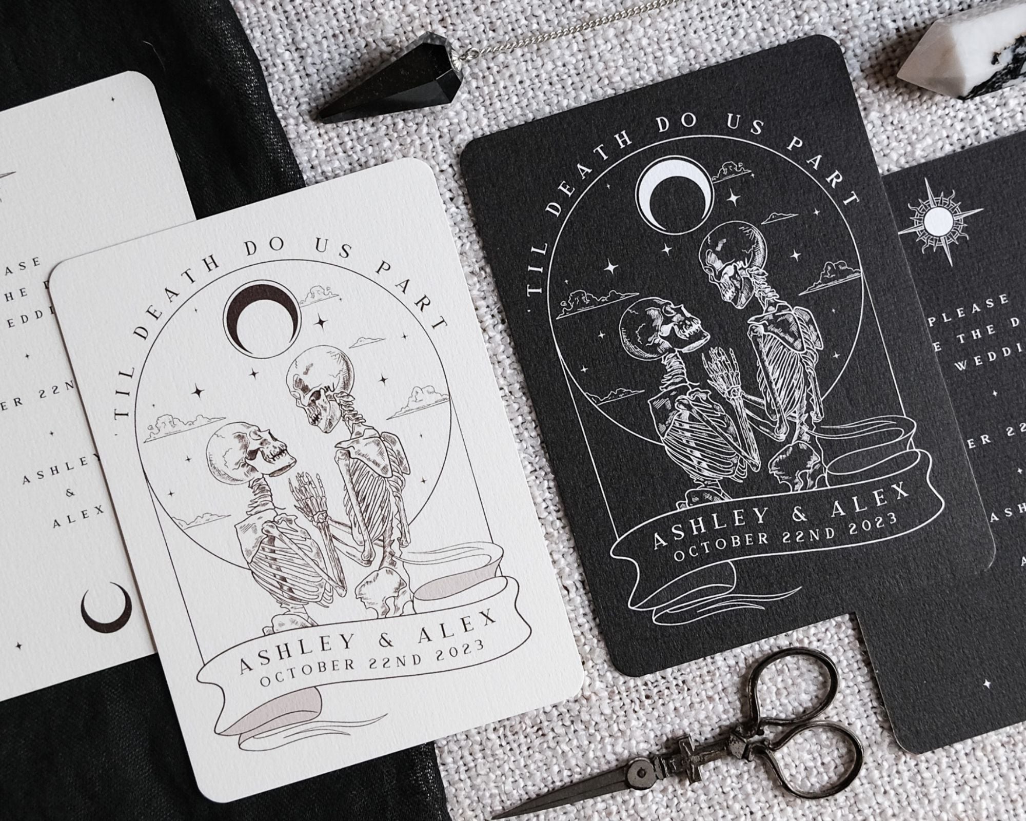 Luxury gothic wedding stationery from the UK with celestial illustrations of skeleton couples, vintage moons, stars, and mountains.