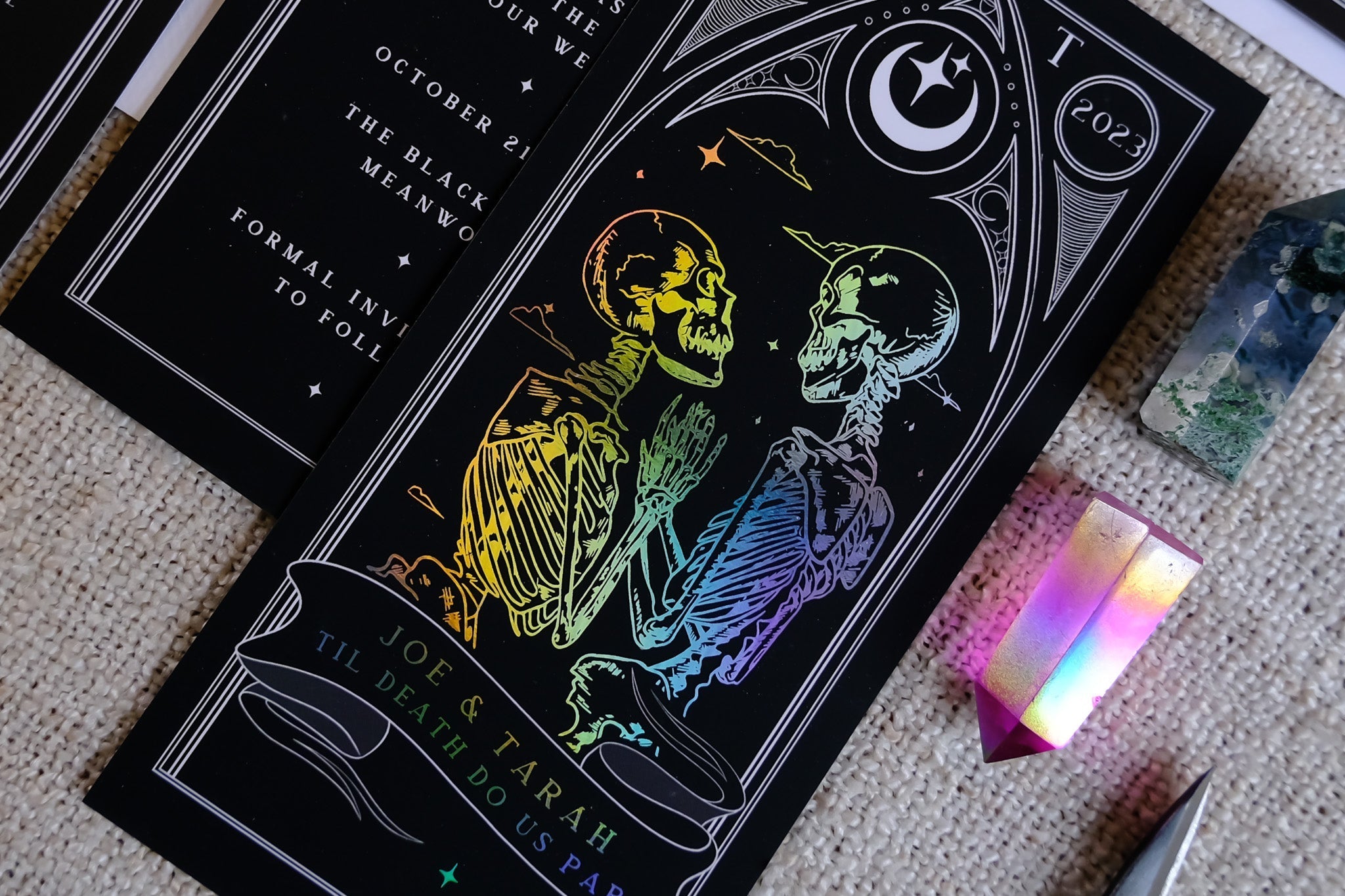 'Til Death Do Us Part' Lovers Foiled Tarot Card 3 Piece Invitation Suite on velvet paper with skeleton design and colorful foil details.