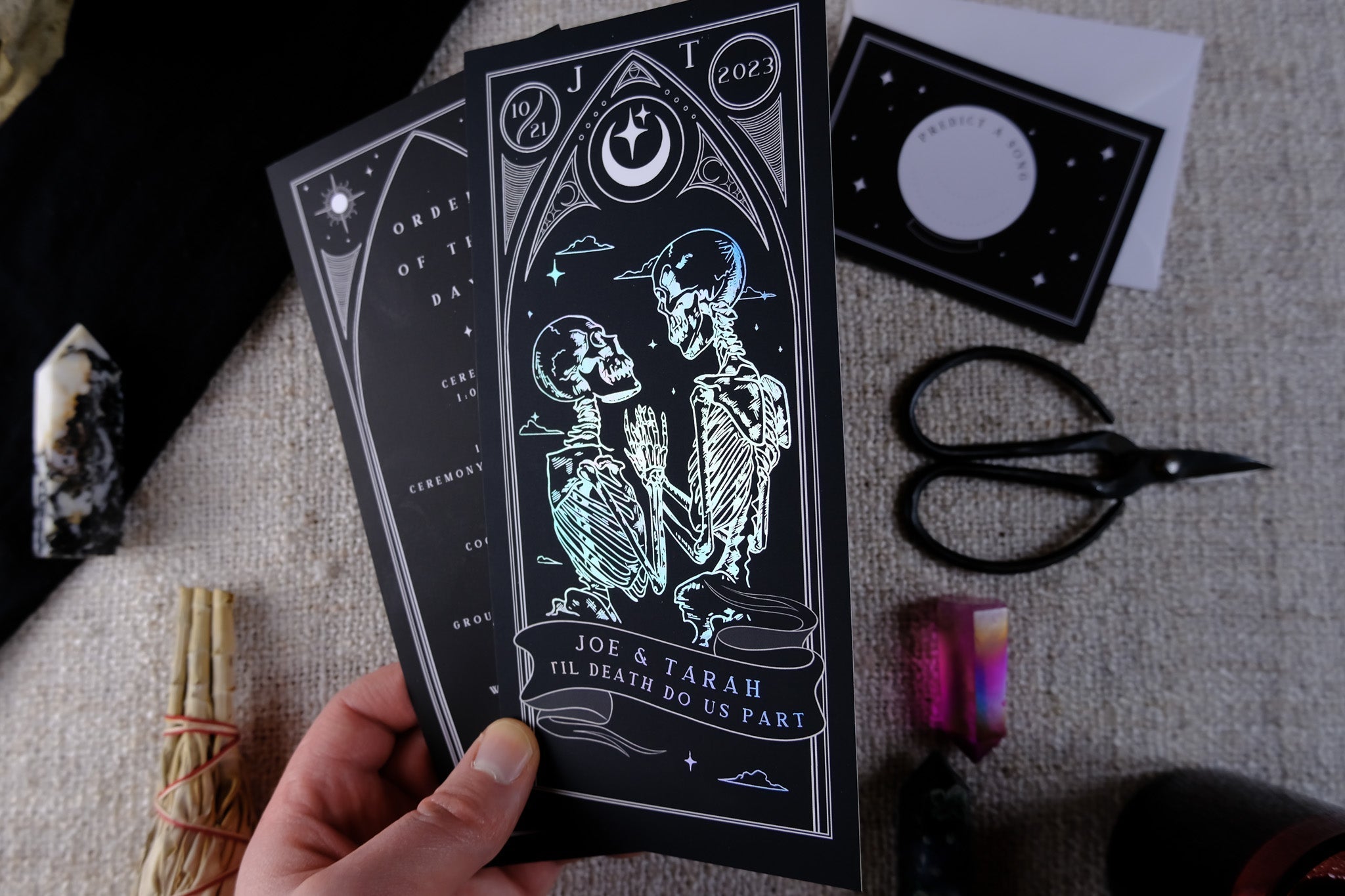 'Til Death Do Us Part' Lovers Foiled Tarot Card 3 Piece Invitation Suite with skeleton design, including Order of the Day and RSVP cards.