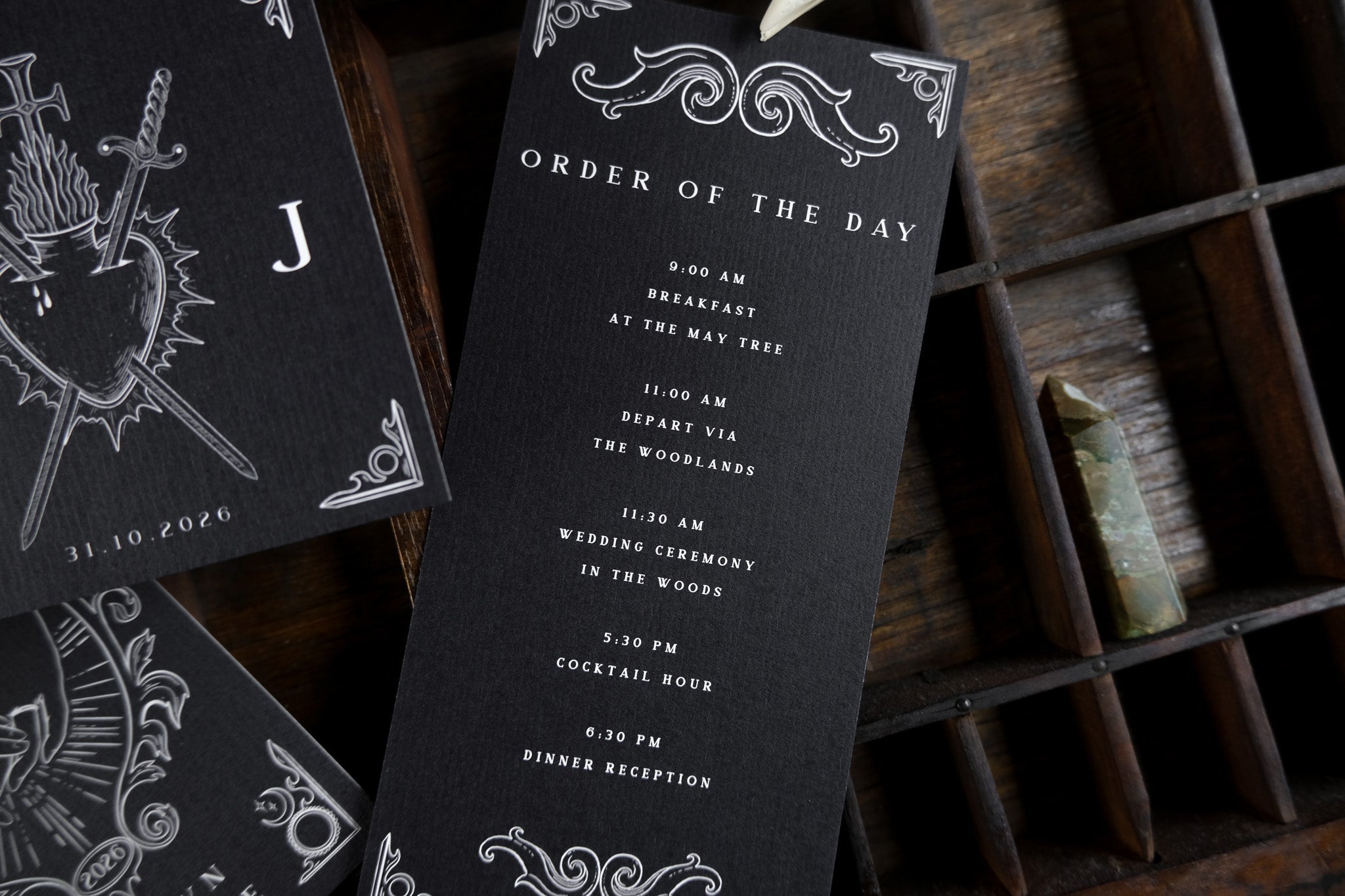 Luxury UK wedding stationery set of three black cards with ornate white Gothic borders, featuring a dramatic and romantic design.