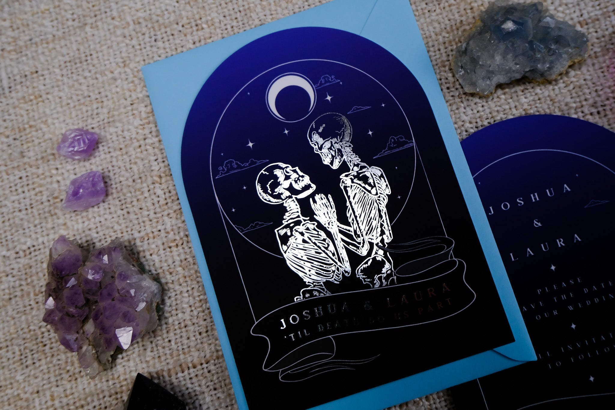 The Lovers Arched Foiled Save The Date card featuring gothic skeleton couple with luxury foil accents on velvet soft-touch card