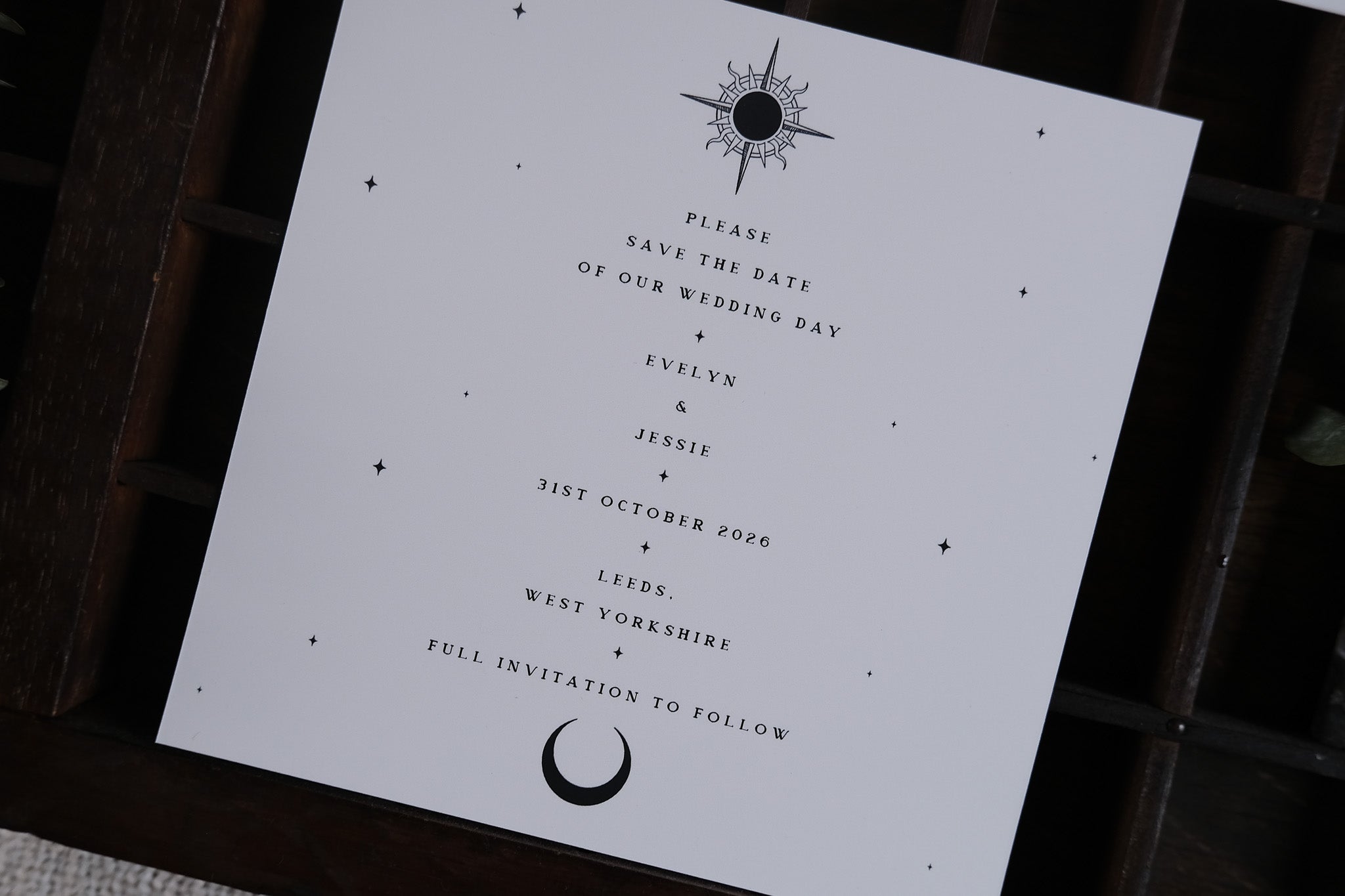 Luxury UK wedding save the date card with gothic bleeding heart motif, dramatic foiled detailing, and celestial-inspired design.