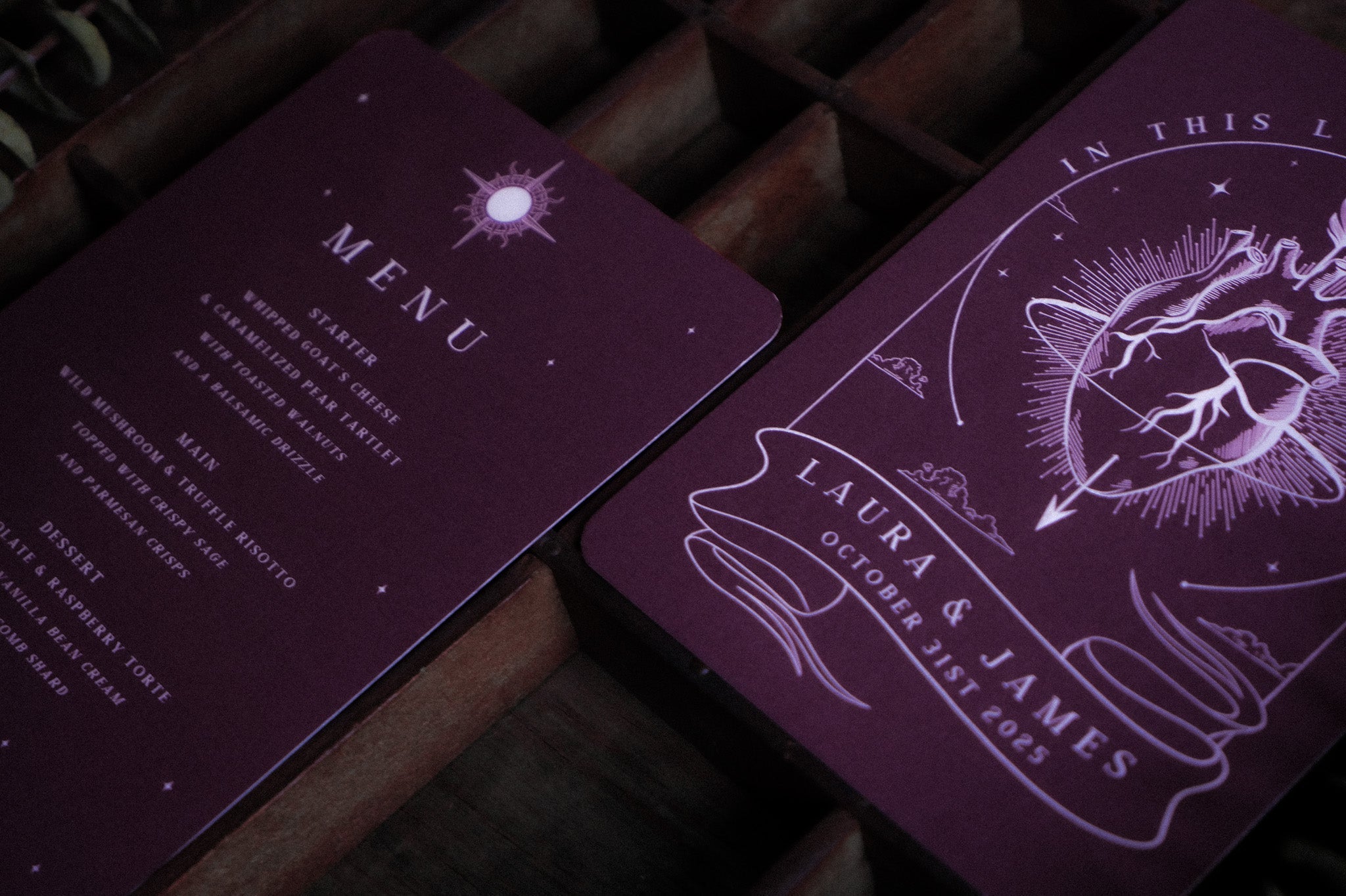 Luxury UK wedding menu card in deep purple with gothic, celestial motifs and dramatic anatomical heart, on premium textured cardstock.