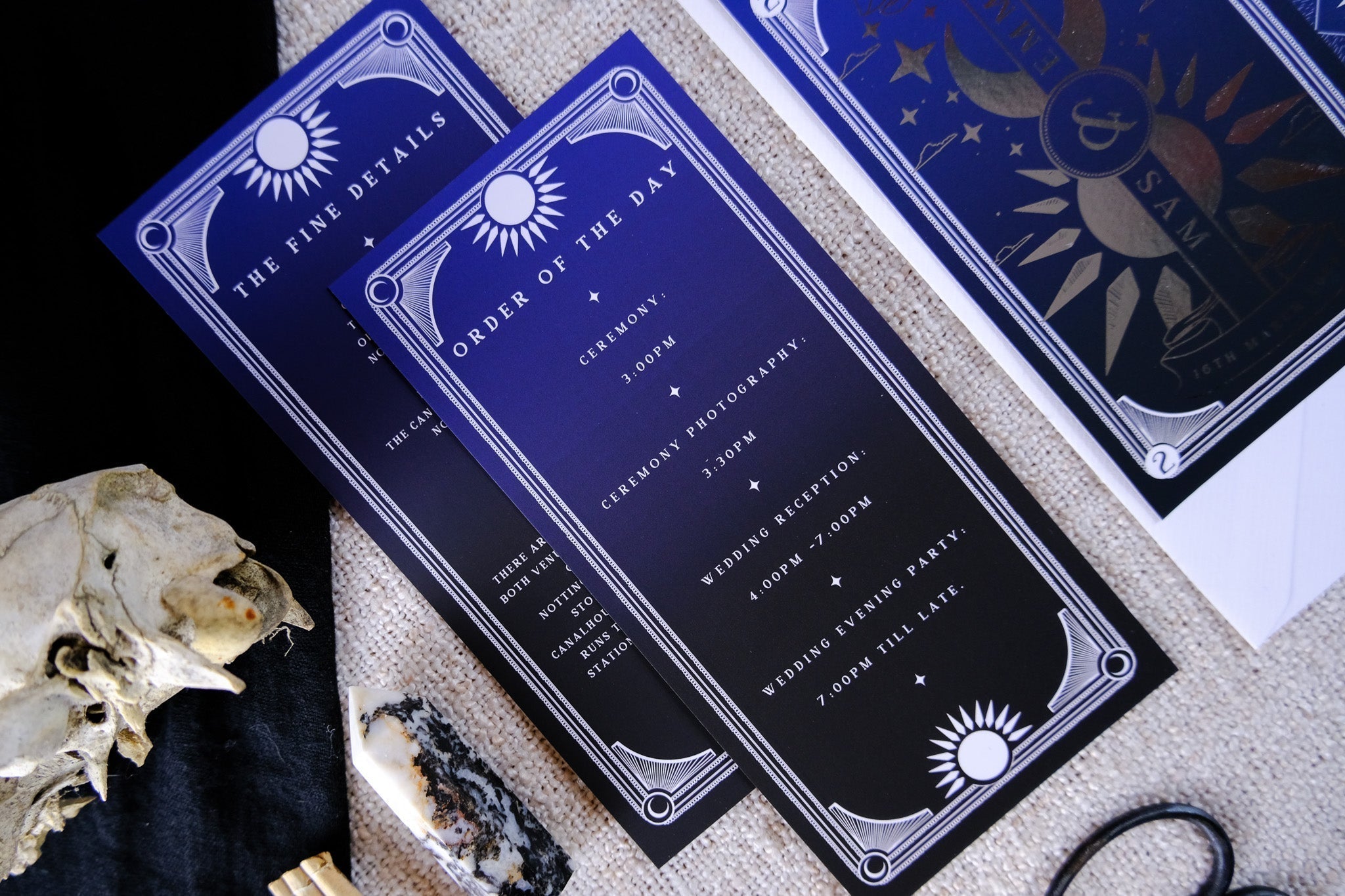 Dusk and Dawn foiled 3-piece wedding invitation suite with celestial sun and moon design on velvet soft-touch card