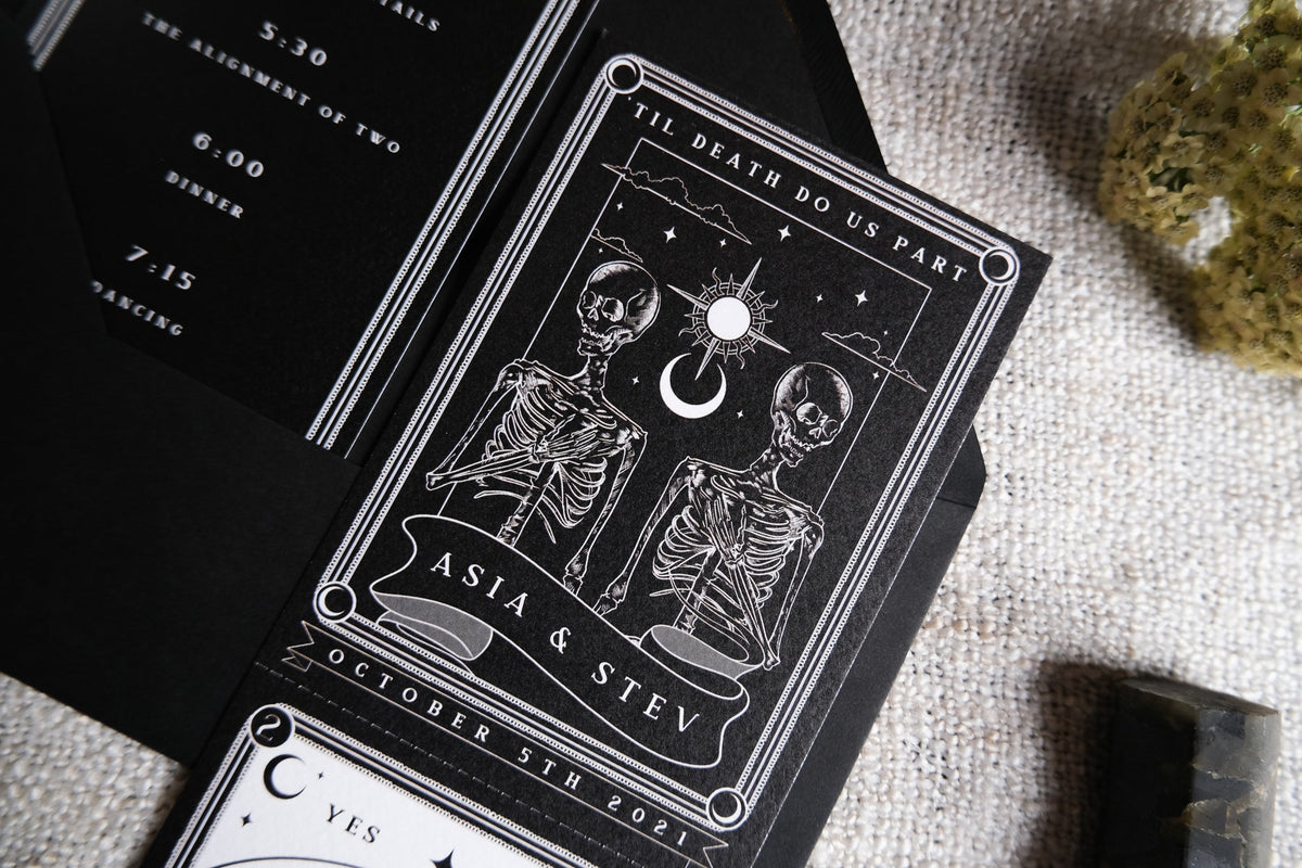 'Til Death Do Us Part' tarot wedding invitation featuring skeleton couple with perforated RSVP card