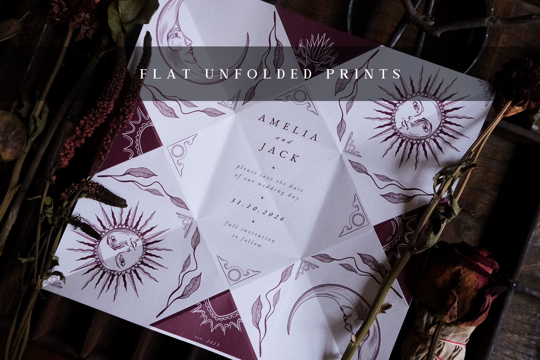 Luxury celestial folding wedding stationery in burgundy and white with boho dried florals, vintage details, and dramatic design.