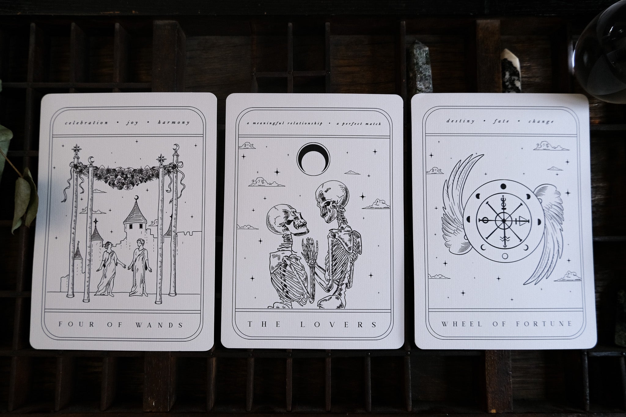 Luxury UK wedding stationery set featuring mystical black and white tarot-inspired illustrations, perfect for a gothic or alternative setting.