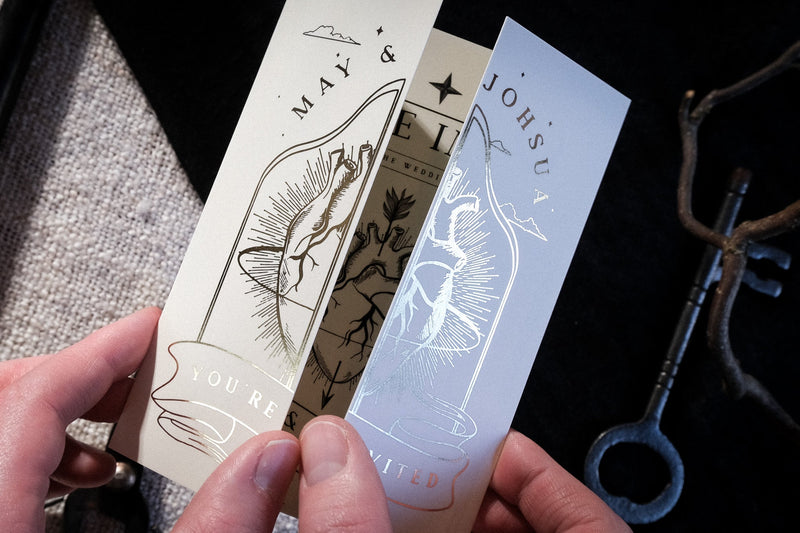 'The Bleeding Heart' foiled gatefold wedding invitation with intricate design and gold foil detailing.