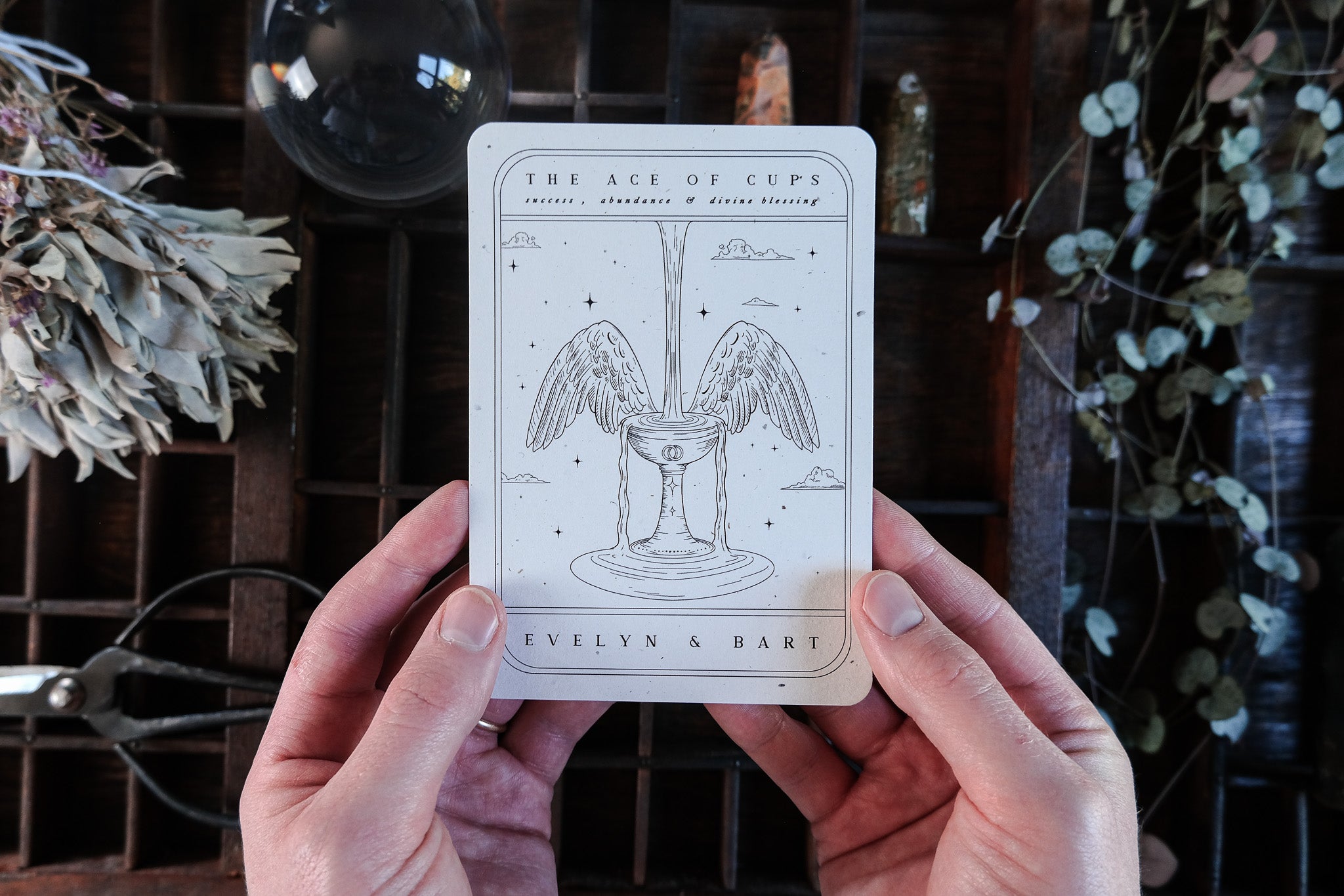 Ace of Cups Tarot Save The Date card featuring a black and white design with customizable colors.

