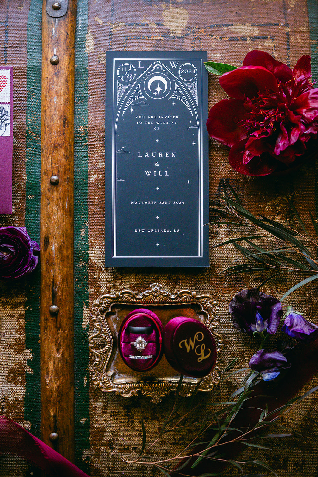 Luxury gothic wedding stationery, dark and elegant, with vintage florals, gold accents, and personalised velvet ring box on rustic wood.