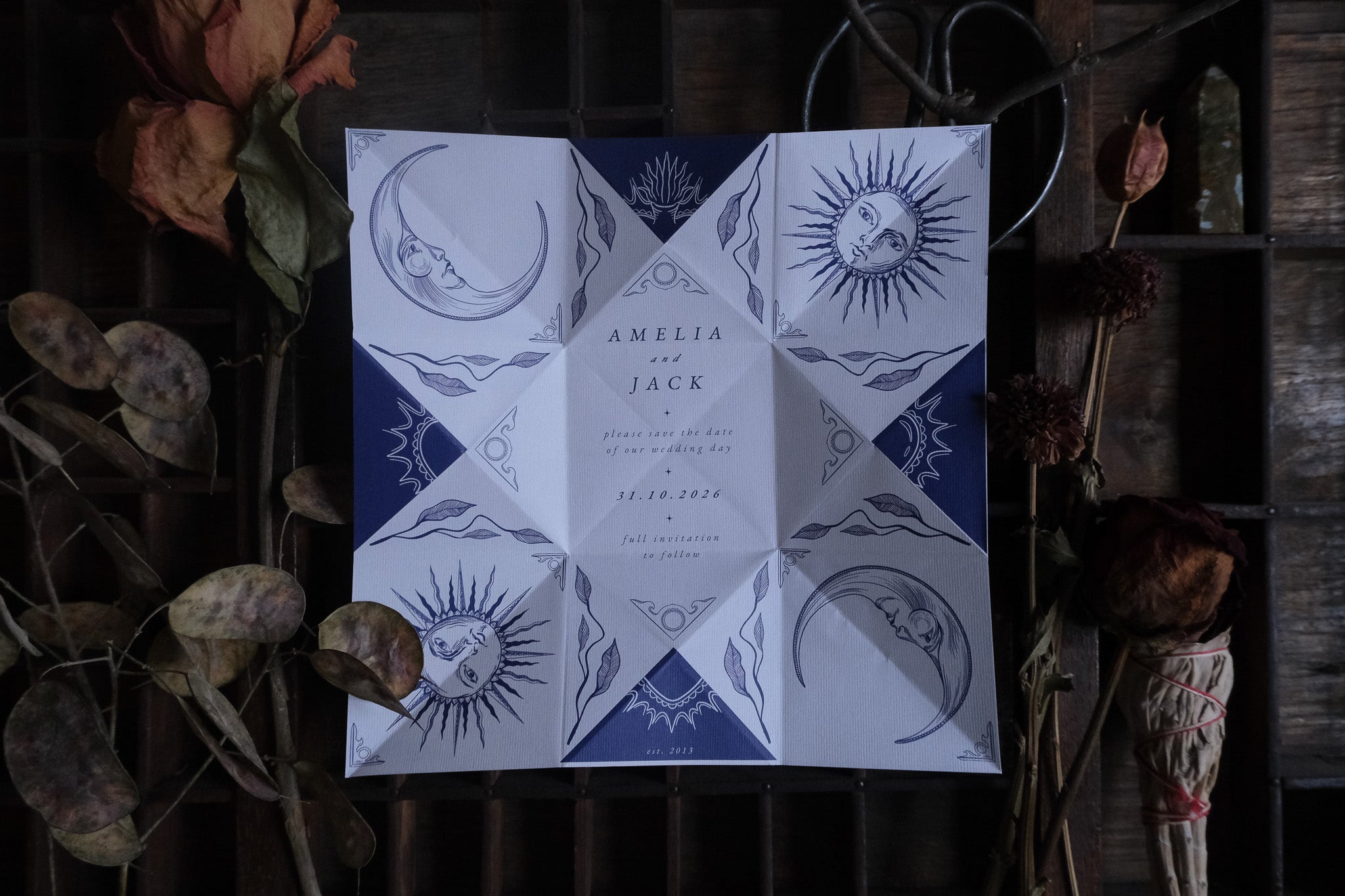 Luxury celestial folding save the date card with gothic sun and moon motifs; vintage-inspired UK wedding stationery on premium paper.