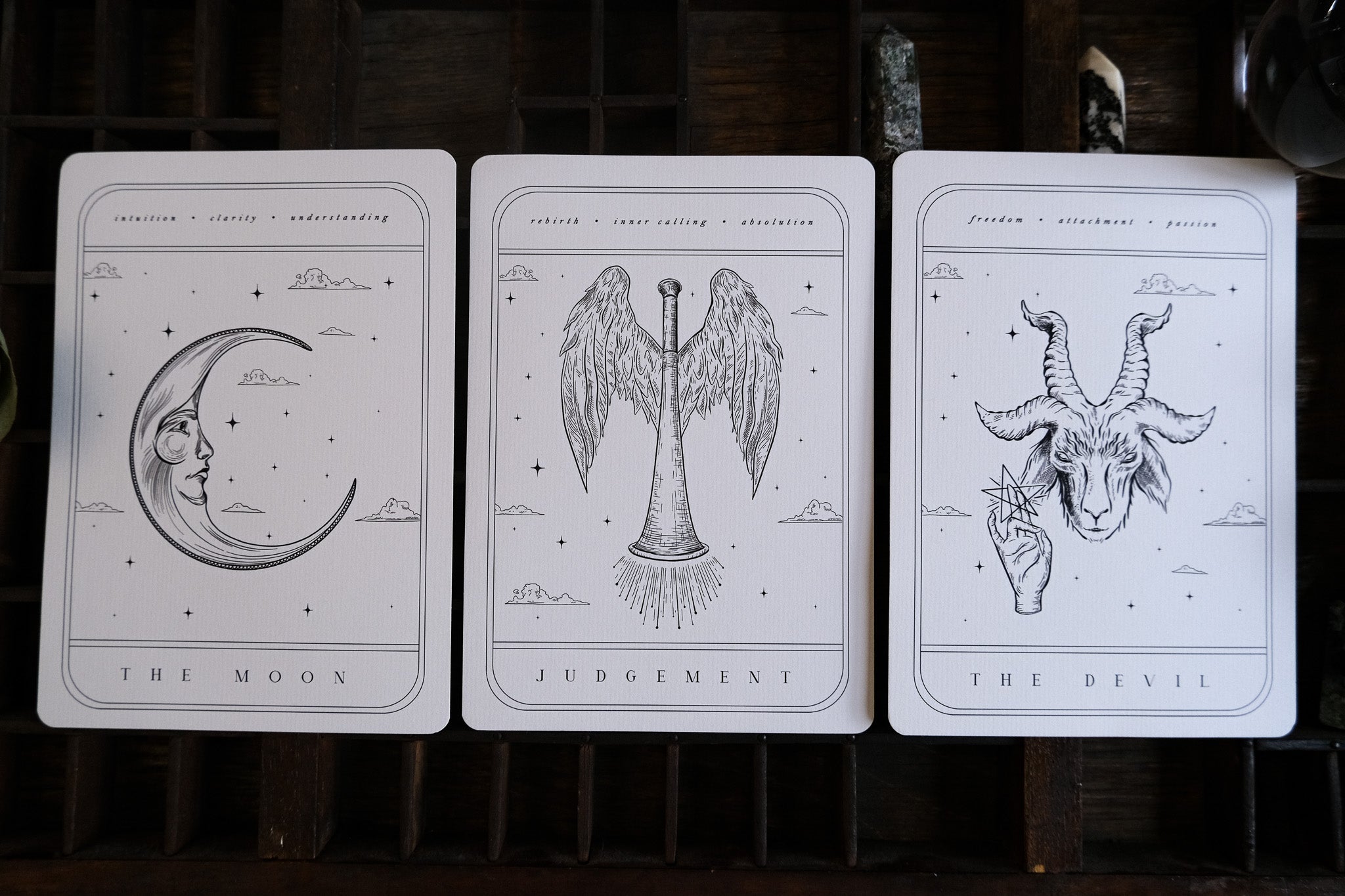 Luxury UK wedding stationery card with minimalist black and white gothic tarot-inspired design on premium textured paper.